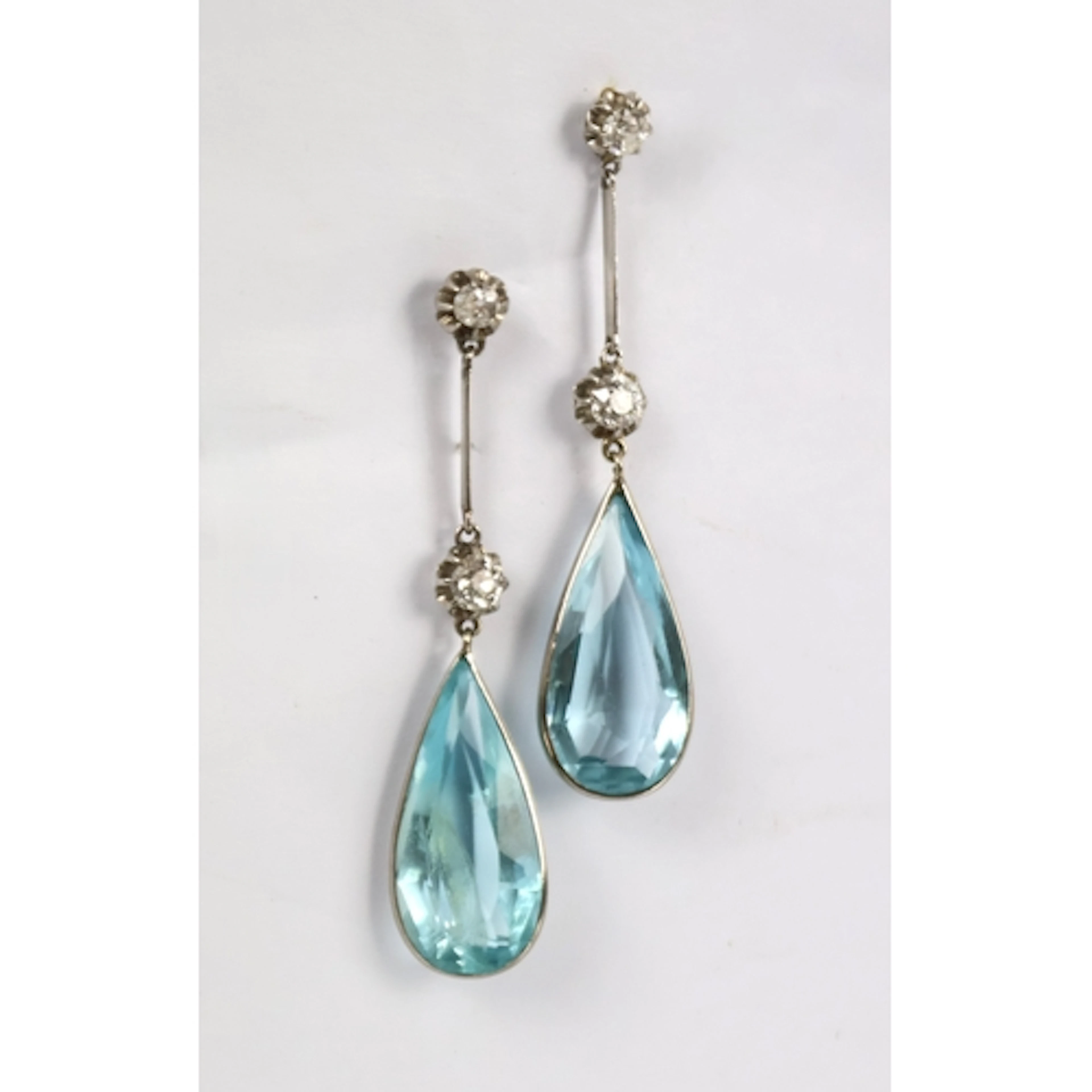 A pair of aquamarine coloured and diamond set drop earrings,...