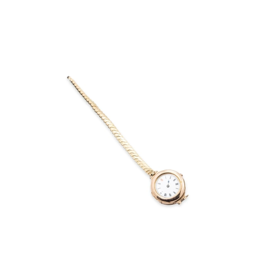 AN ANTIQUE GOLD CASED WATCH, on plated strap, 23 g g/w.