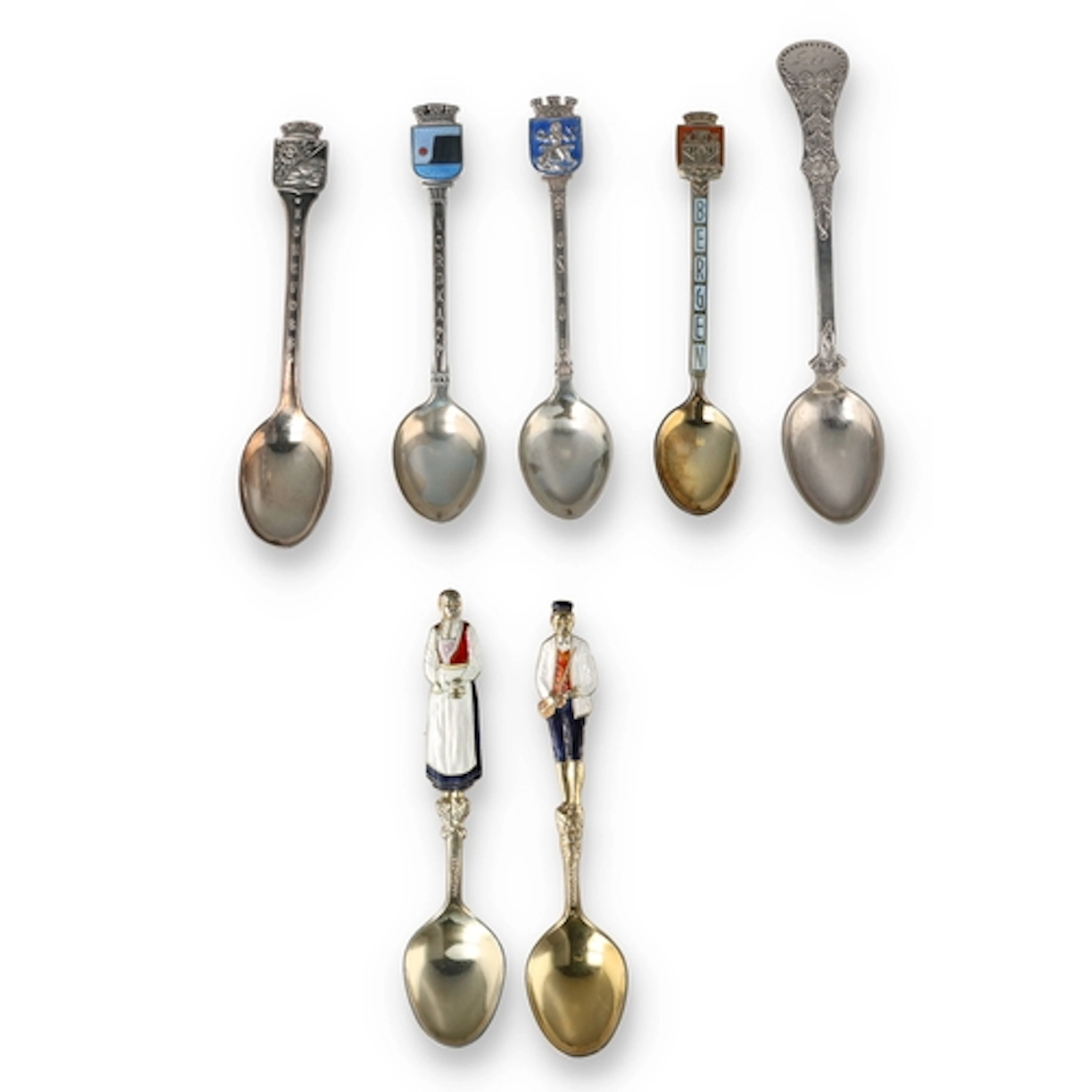 A PAIR OF NORWEGIAN SILVER-GILT AND ENAMEL SPOONS WITH FIGUR...