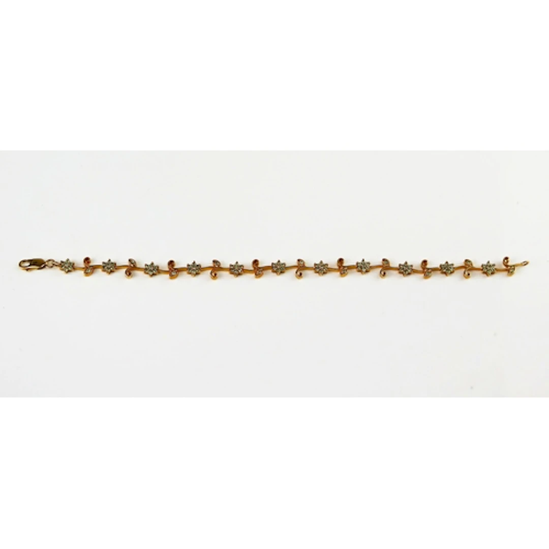 An alexandrite foliate scroll bracelet in a 9ct yellow gold ...