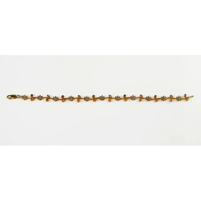 An alexandrite foliate scroll bracelet in a 9ct yellow gold ...