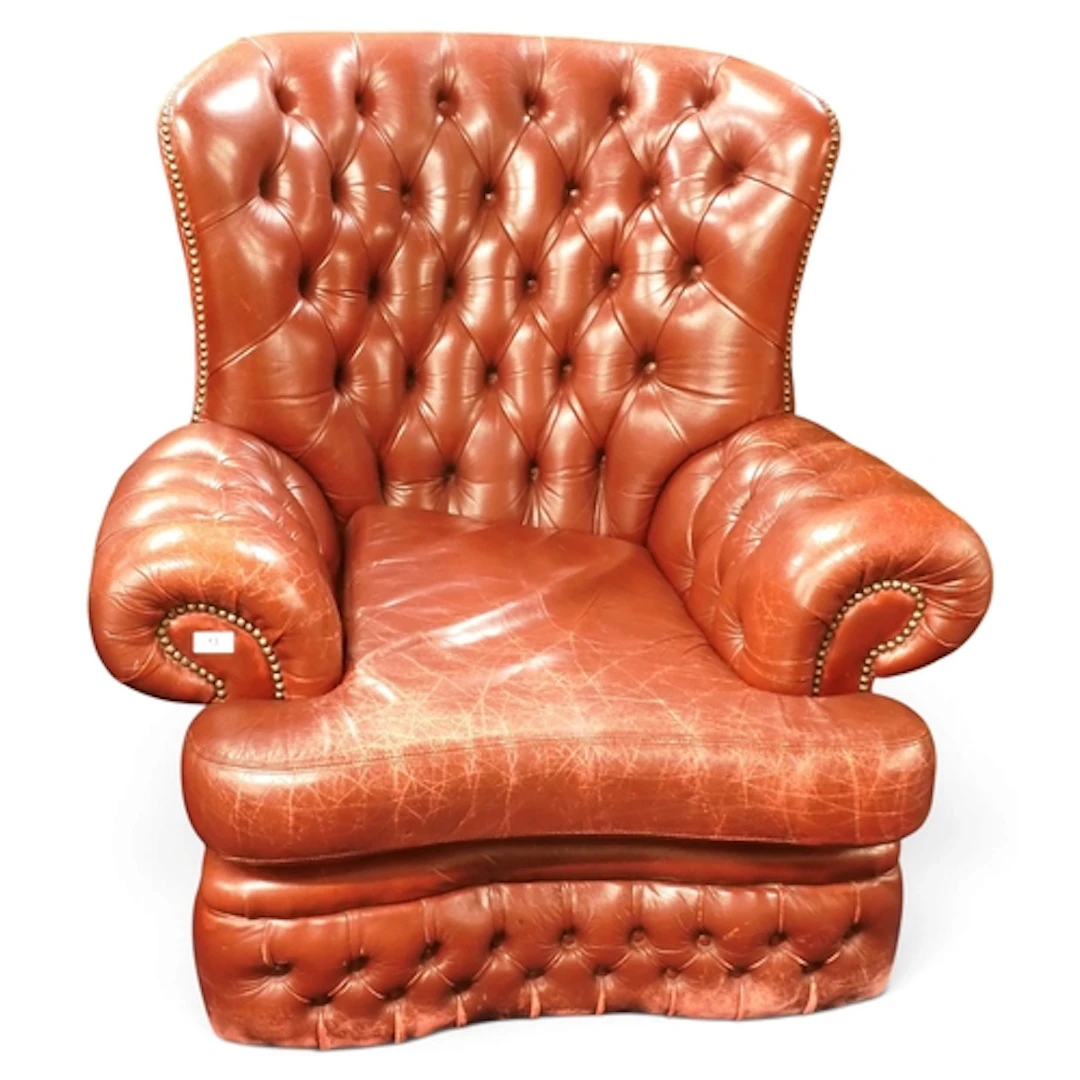 A 20th century oxblood leather button back upholstered Chest...