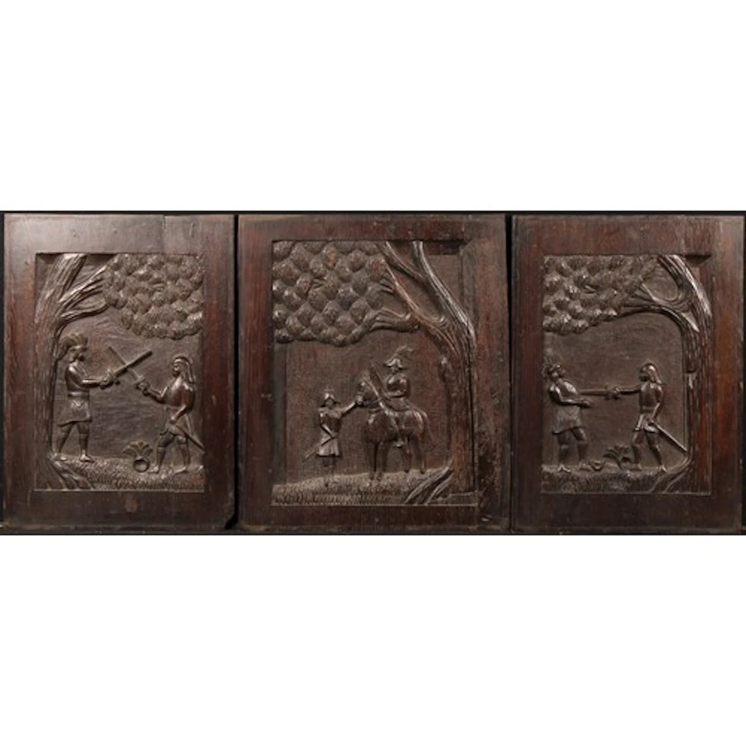 A 19th century garniture of three oak panels carved with Col...