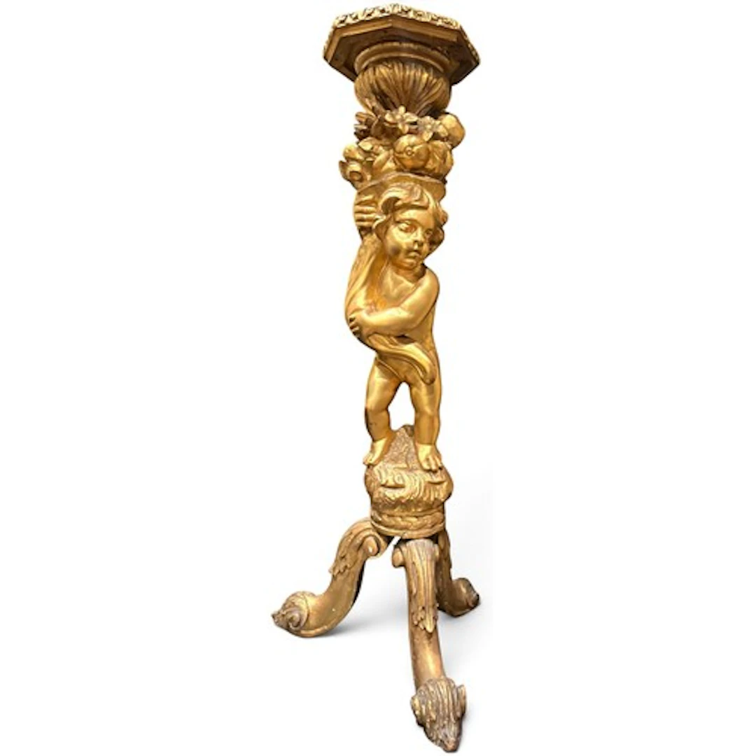 A decorative carved wood and gilt gesso torchère stand, pres...