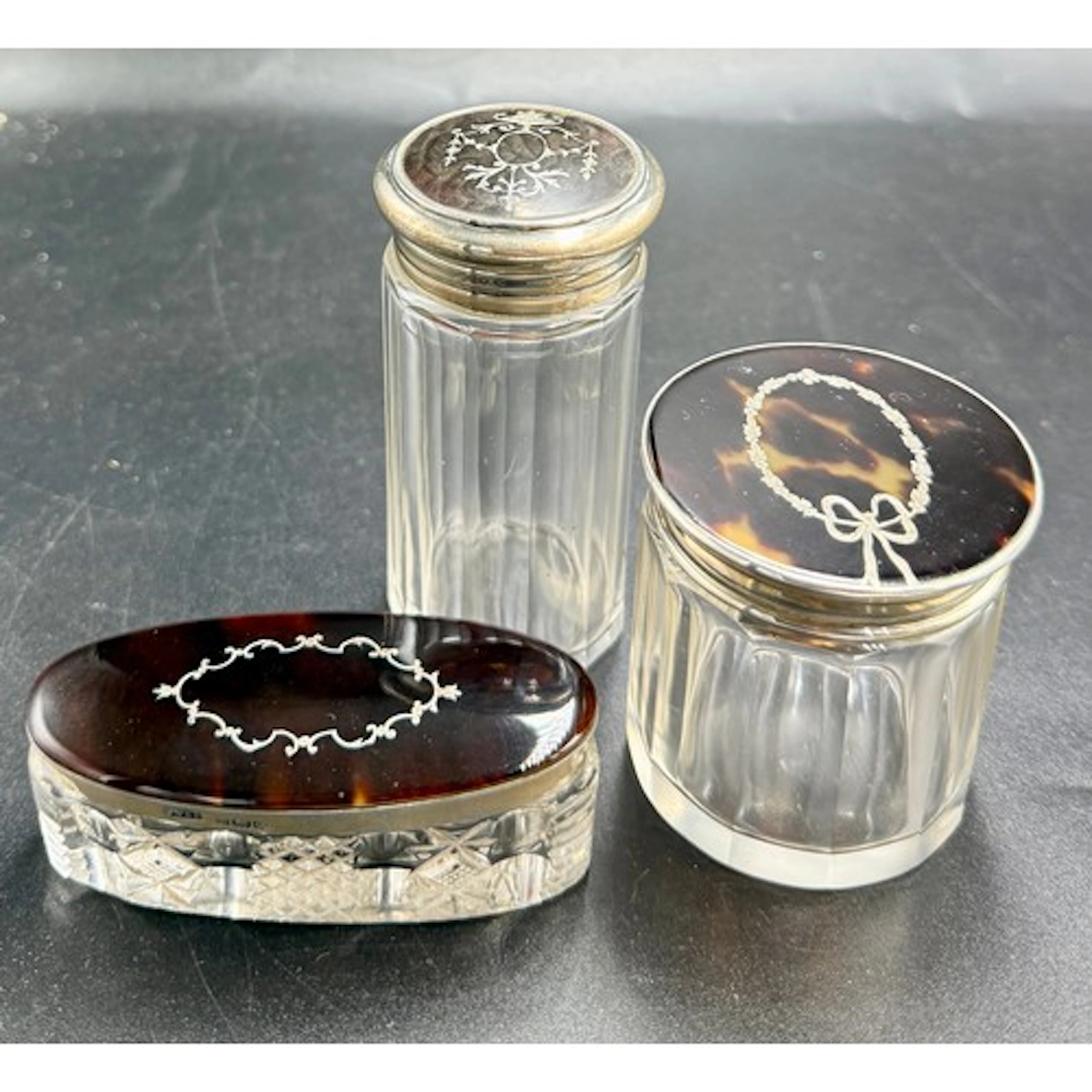 Three glass jars with hallmarked silver tortoiseshell pique ...