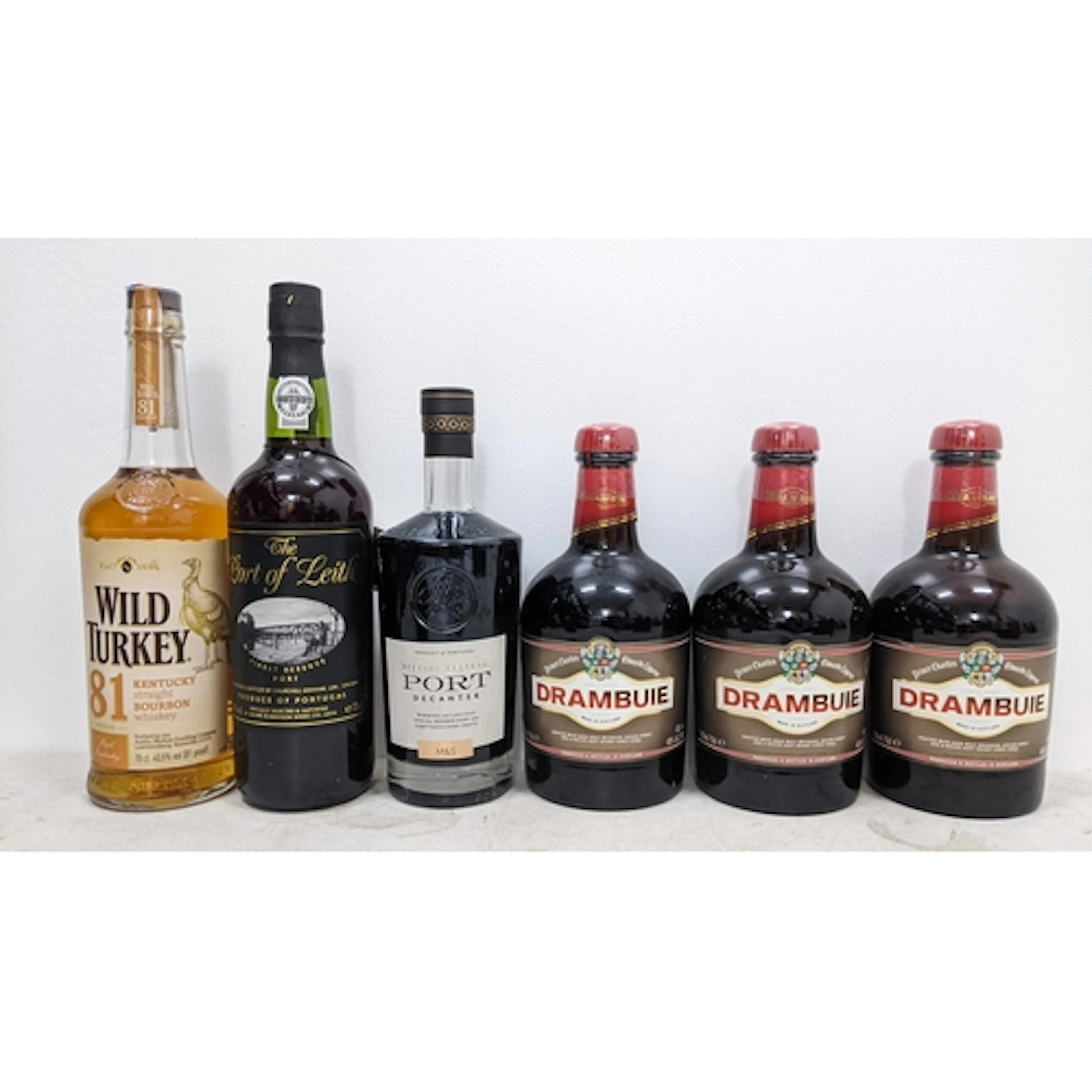 Six bottles of assorted whisky, liqueur and Port, comprising...