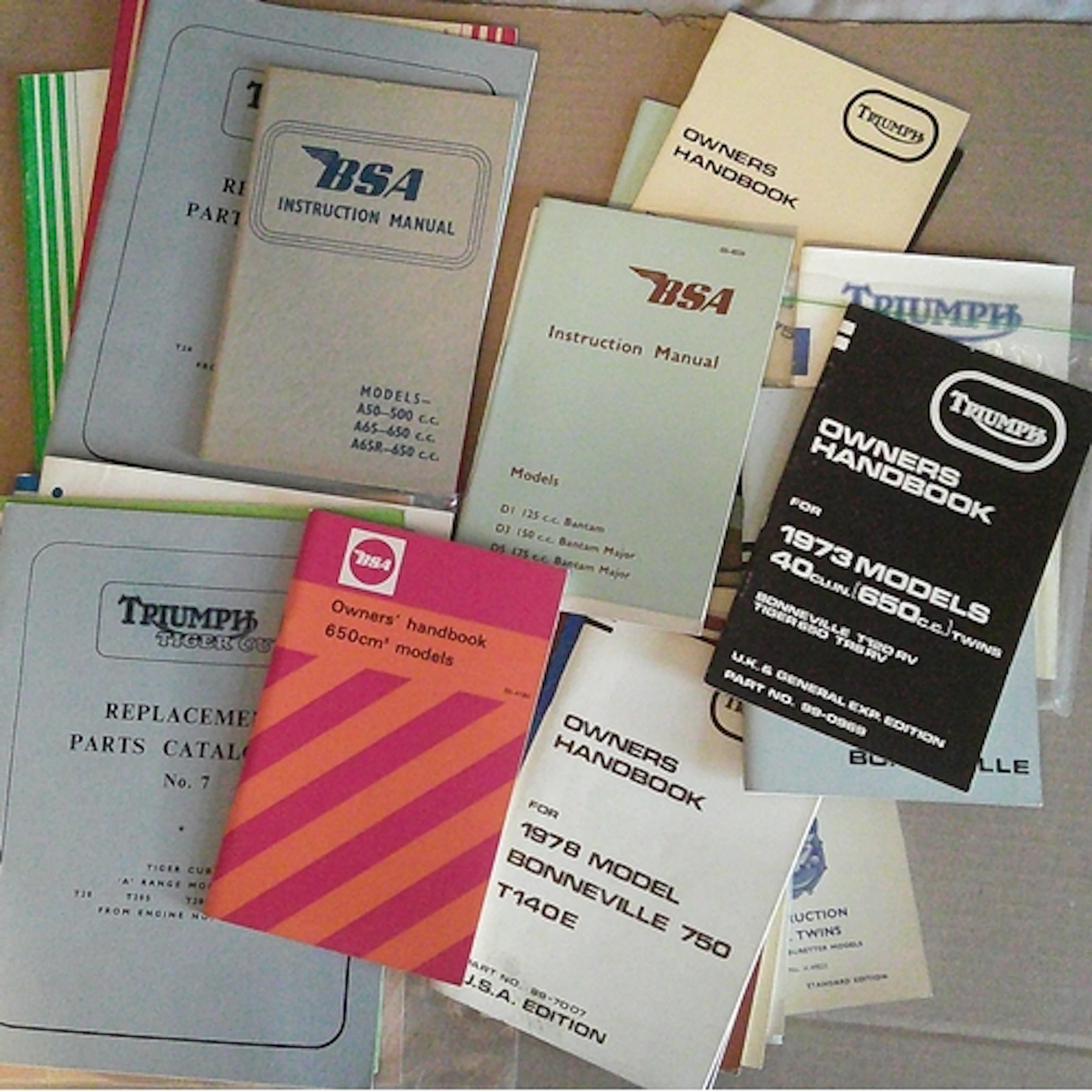 Collection of BSA and Triumph motorcycle handbooks along wit...