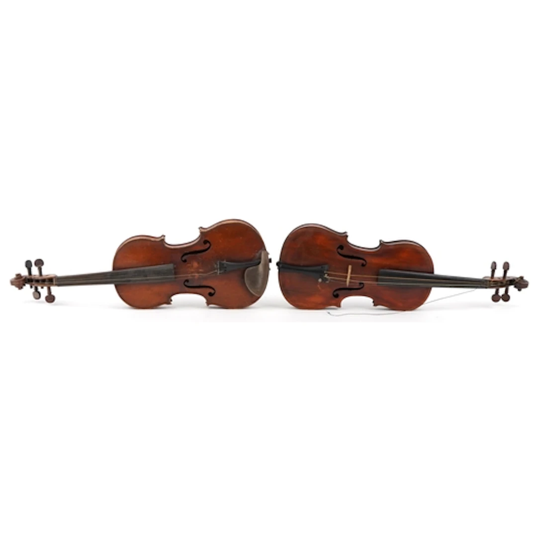 Two old wooden violins in cases, one bearing Medio Fino labe...