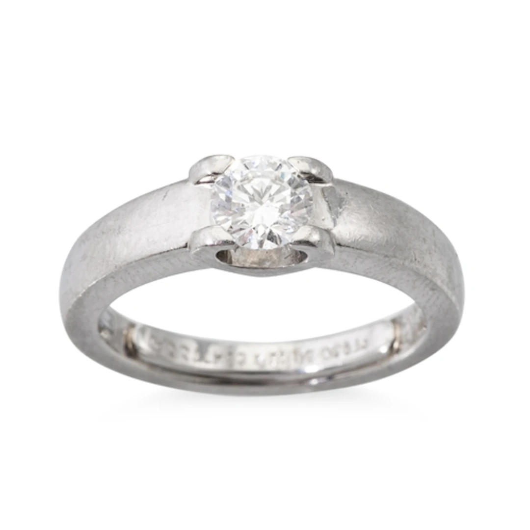 A CARTIER DIAMOND RING, signed Cartier, stamped 950 for plat...