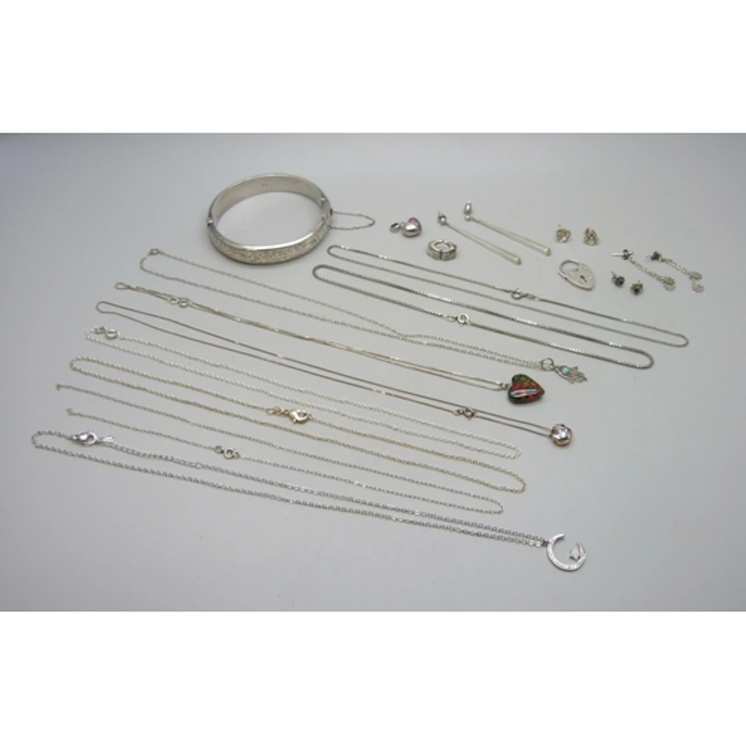 A collection of silver and white metal jewellery including a...