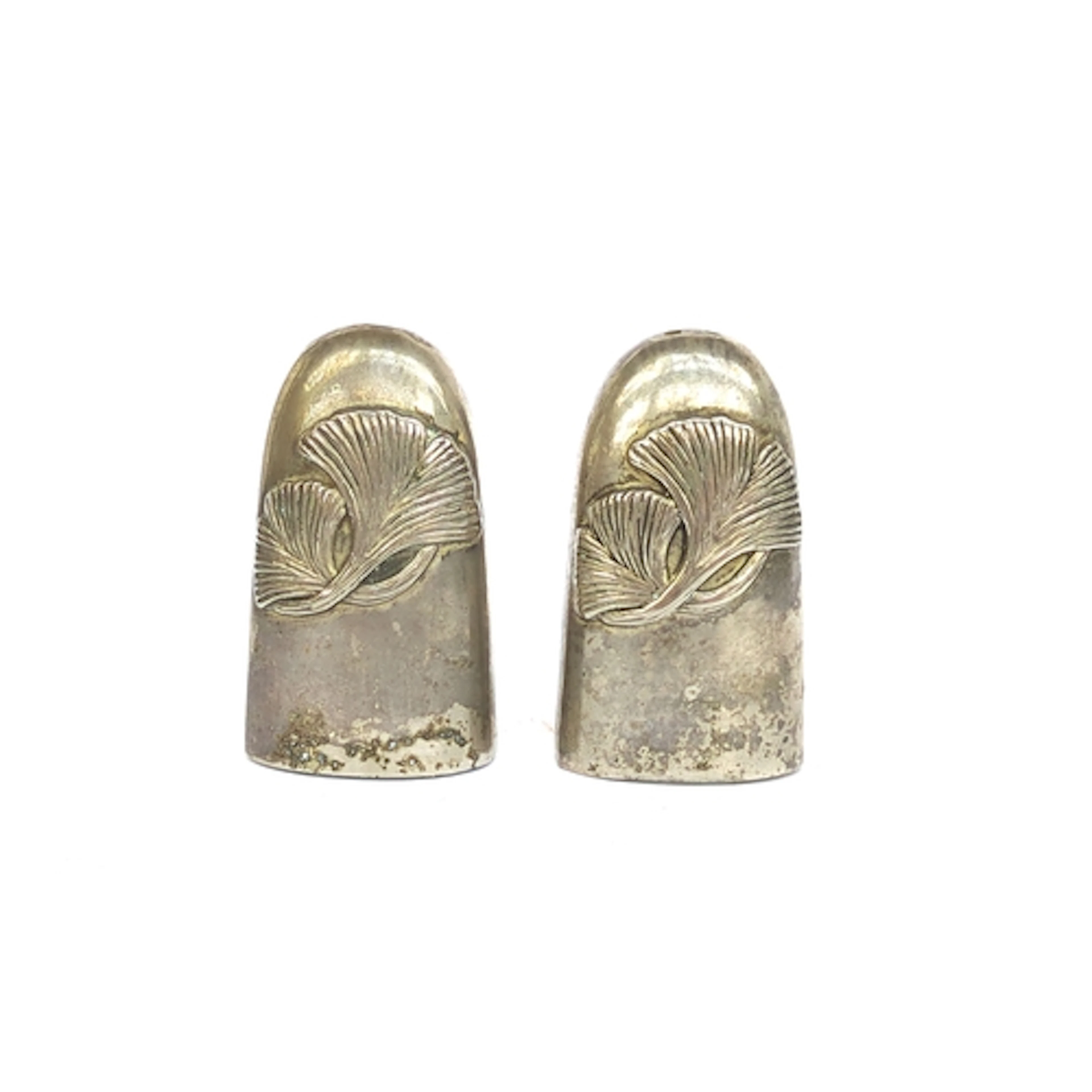 A pair of Silea salt and peppers decorated with Art Nouveau ...