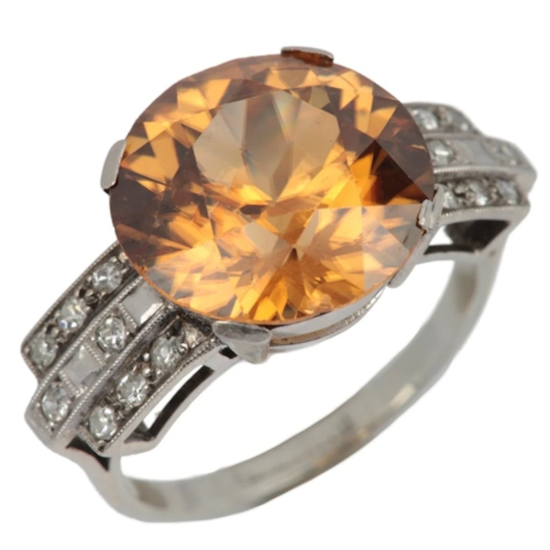 A zircon and diamond ring, mid 20th century, claw-set with a...