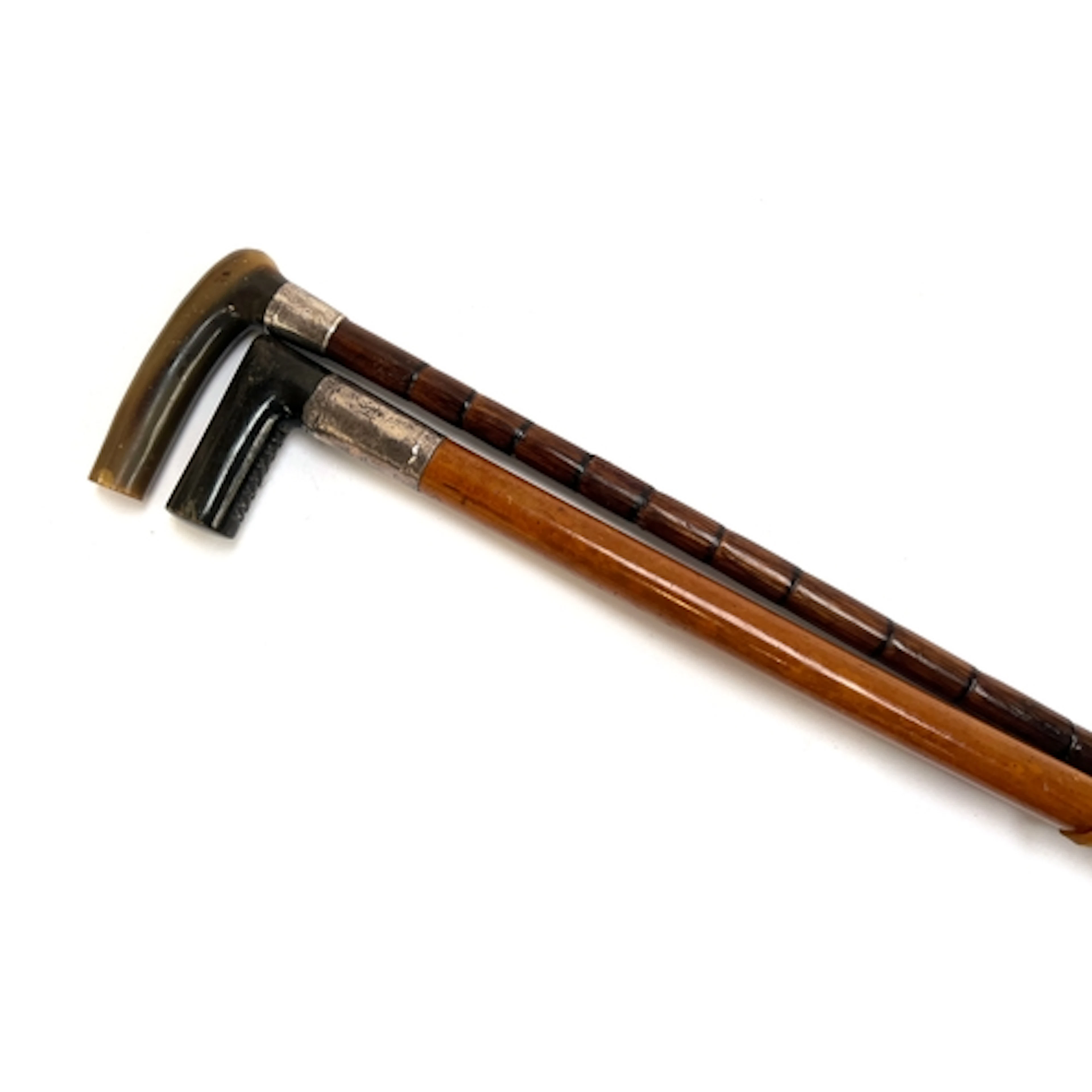 A late 19th/early 20th century malacca walking cane with hor...