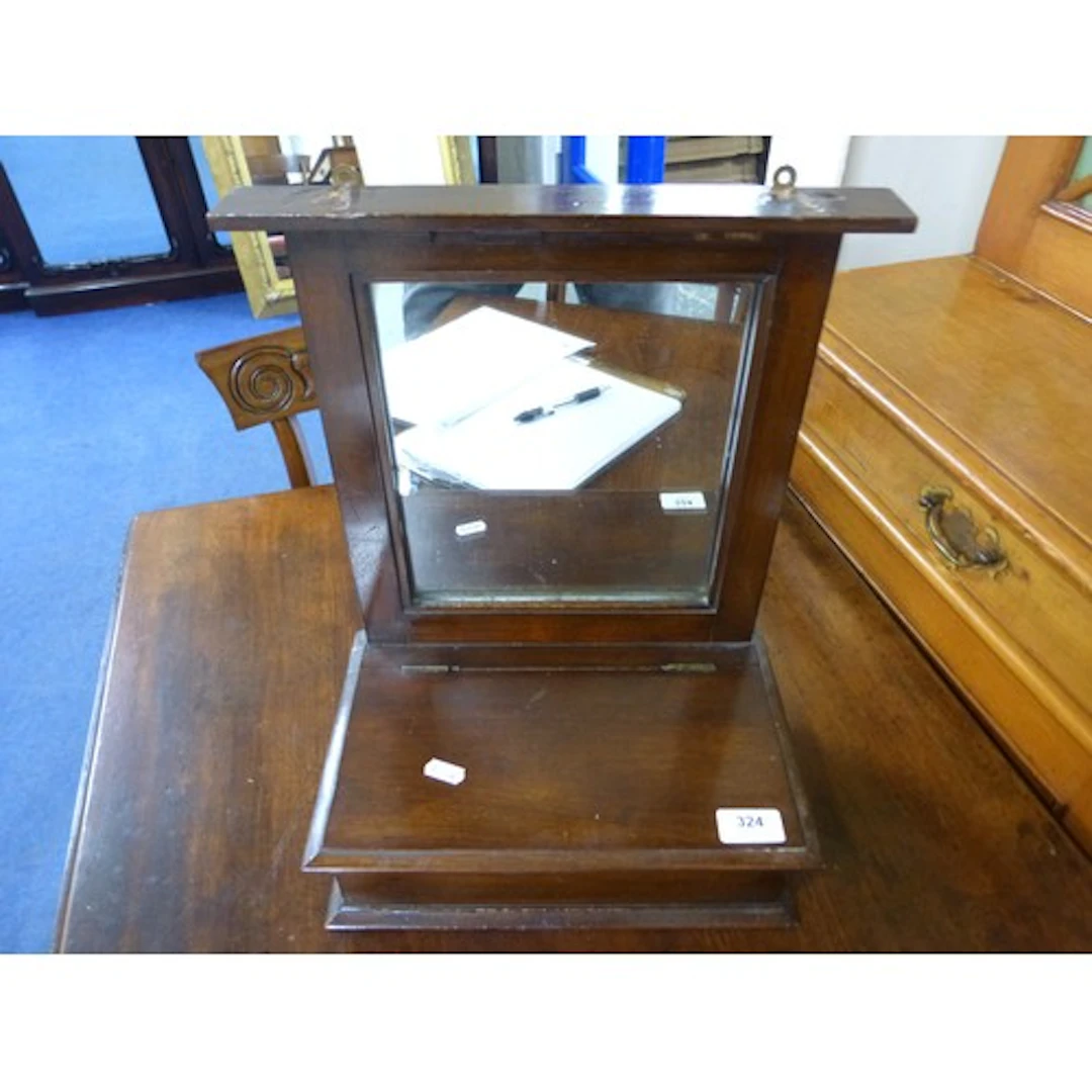Mahogany wall mounted mirror with candle box to base.