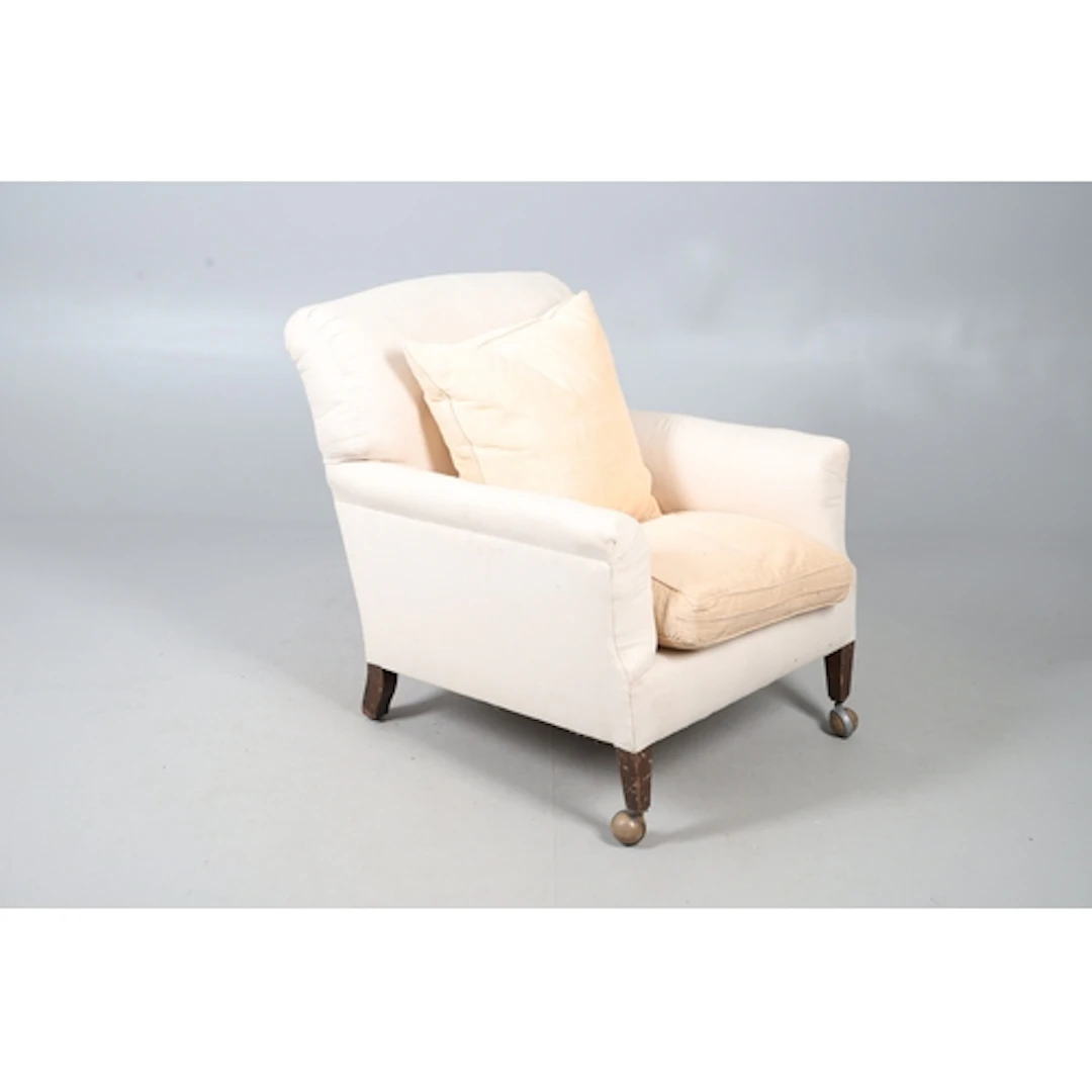 A HOWARD & SONS MAHOGANY DEEP SEATED ARMCHAIR, CIRCA 1900. u...
