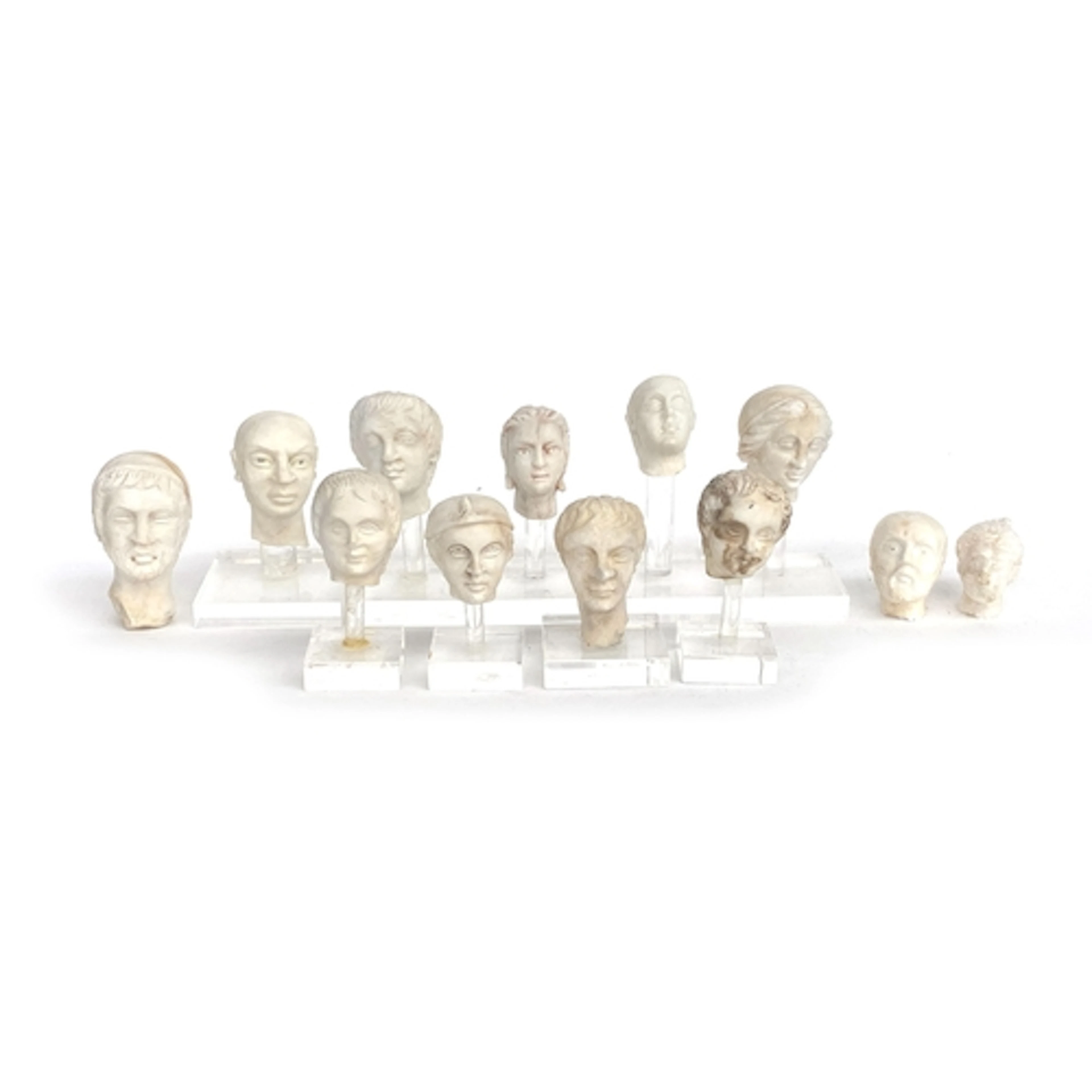 A collection of ancient style carved marble and alabaster sc...