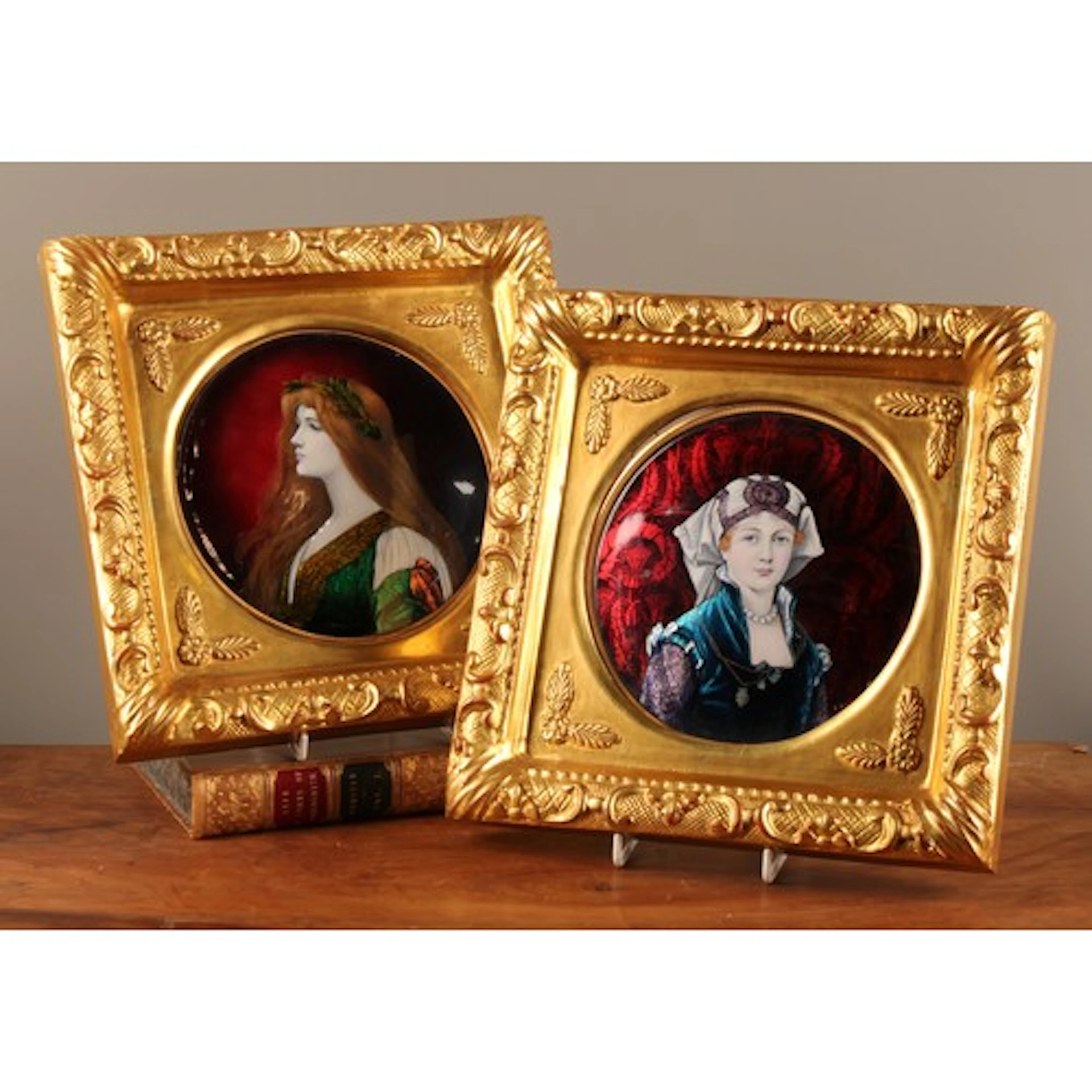 A pair of French Art Nouveau period Limoges enamel tondo por...