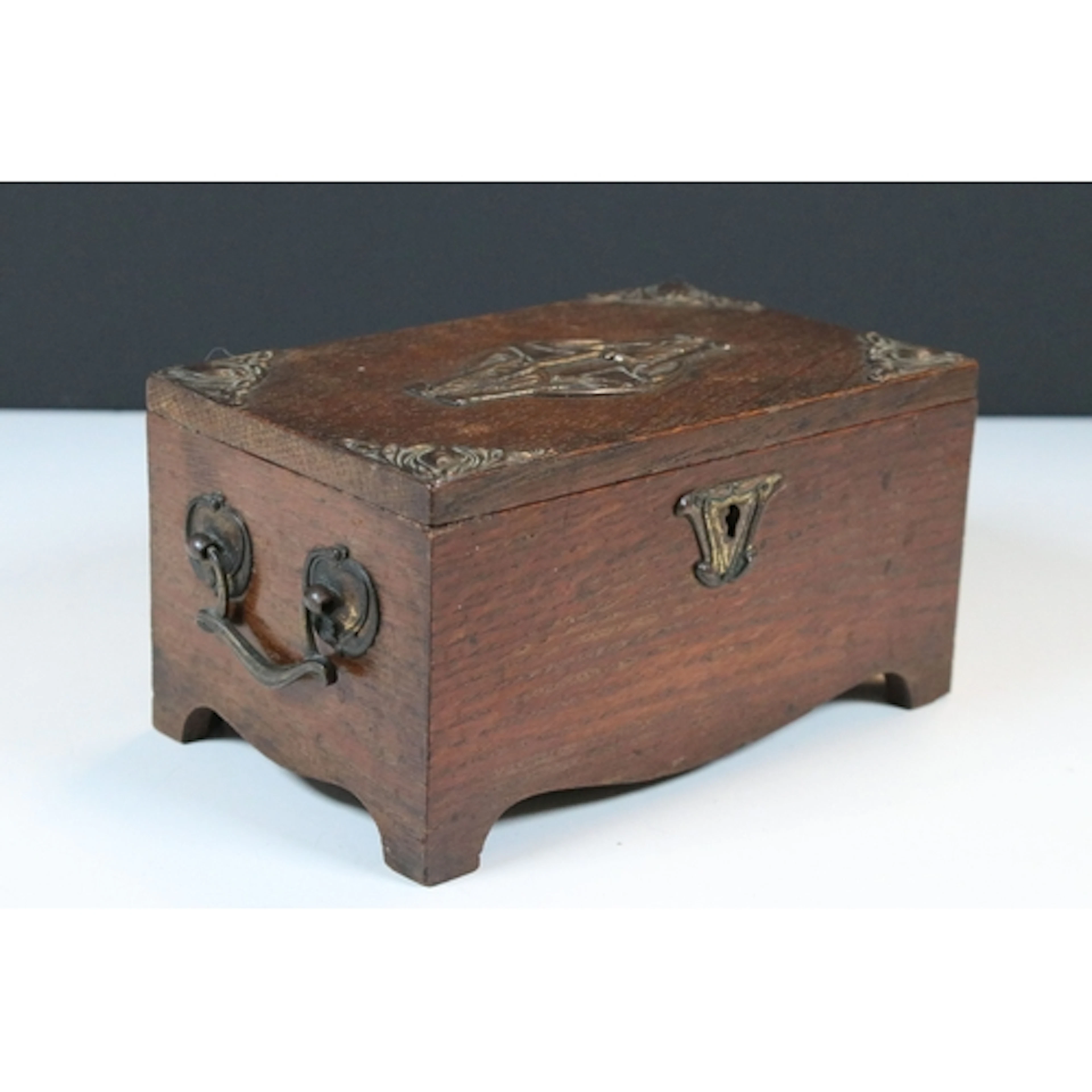 Art Nouveau oak and brass mounted box, having stylised brass...