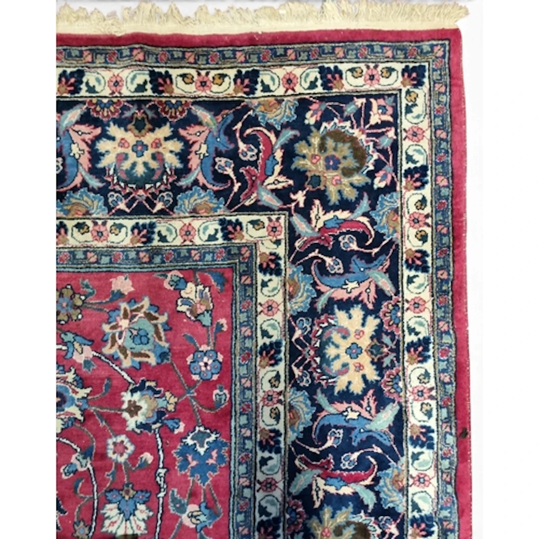 A large Persian Carpet with red and blue ground and unique c...