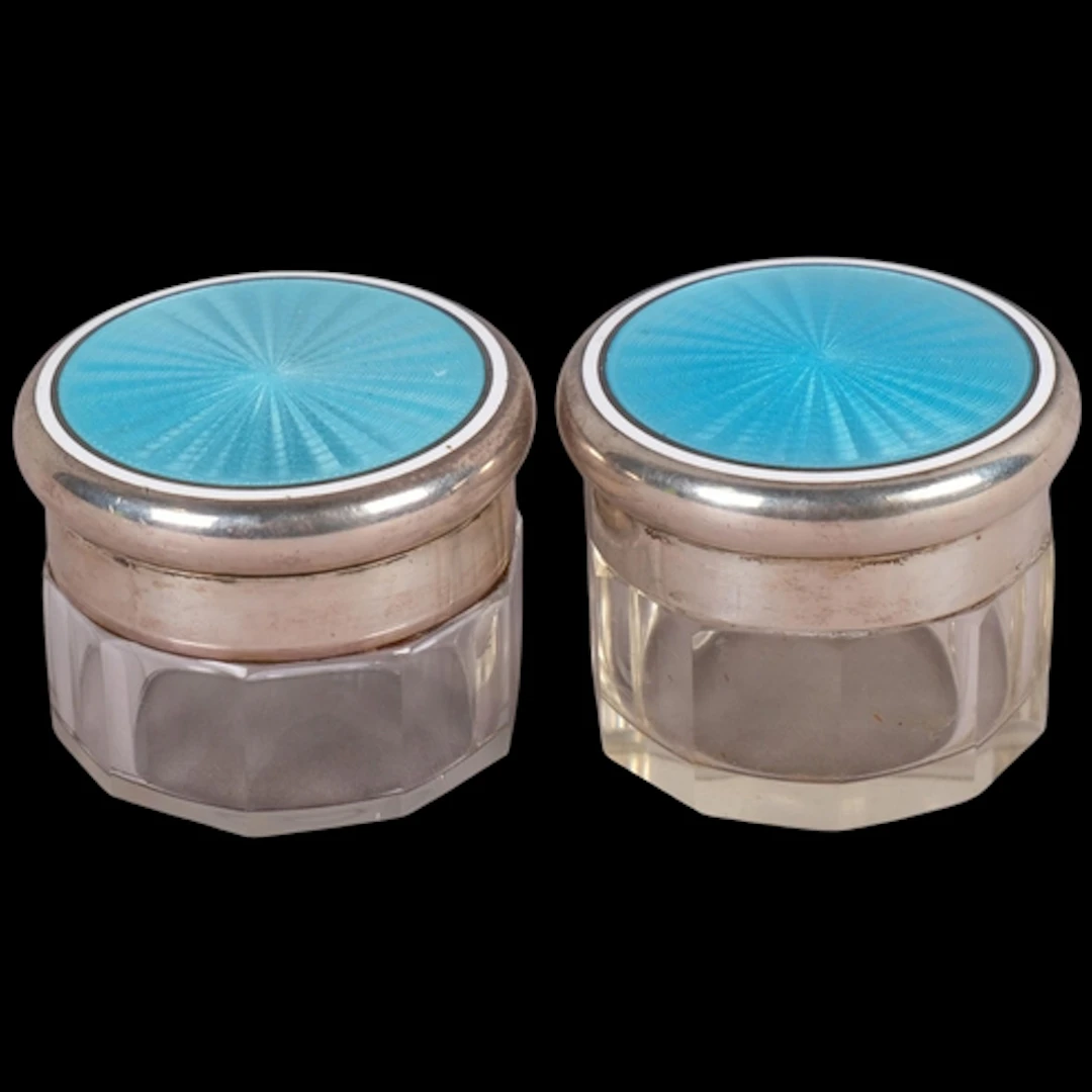 A pair of Art Deco George V silver and enamel mounted glass ...