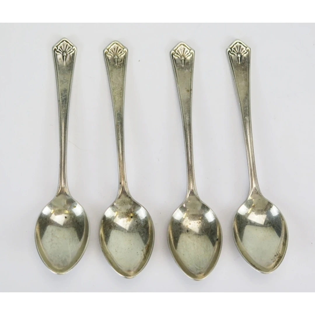 Four Elizabeth II silver teaspoons, maker James Dixon & Sons...
