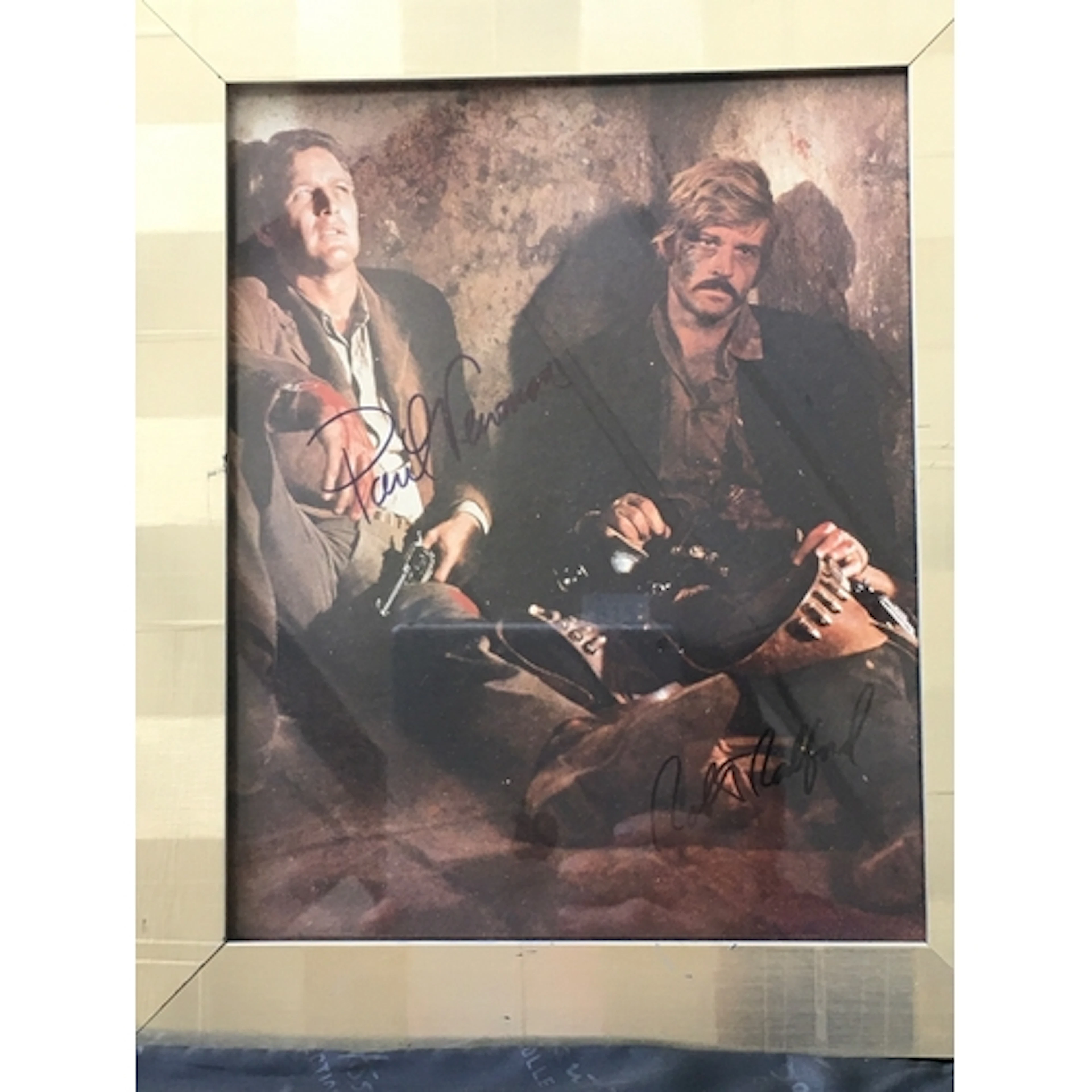 A framed and glazed Paul Newman and Robert Redford signed ph...