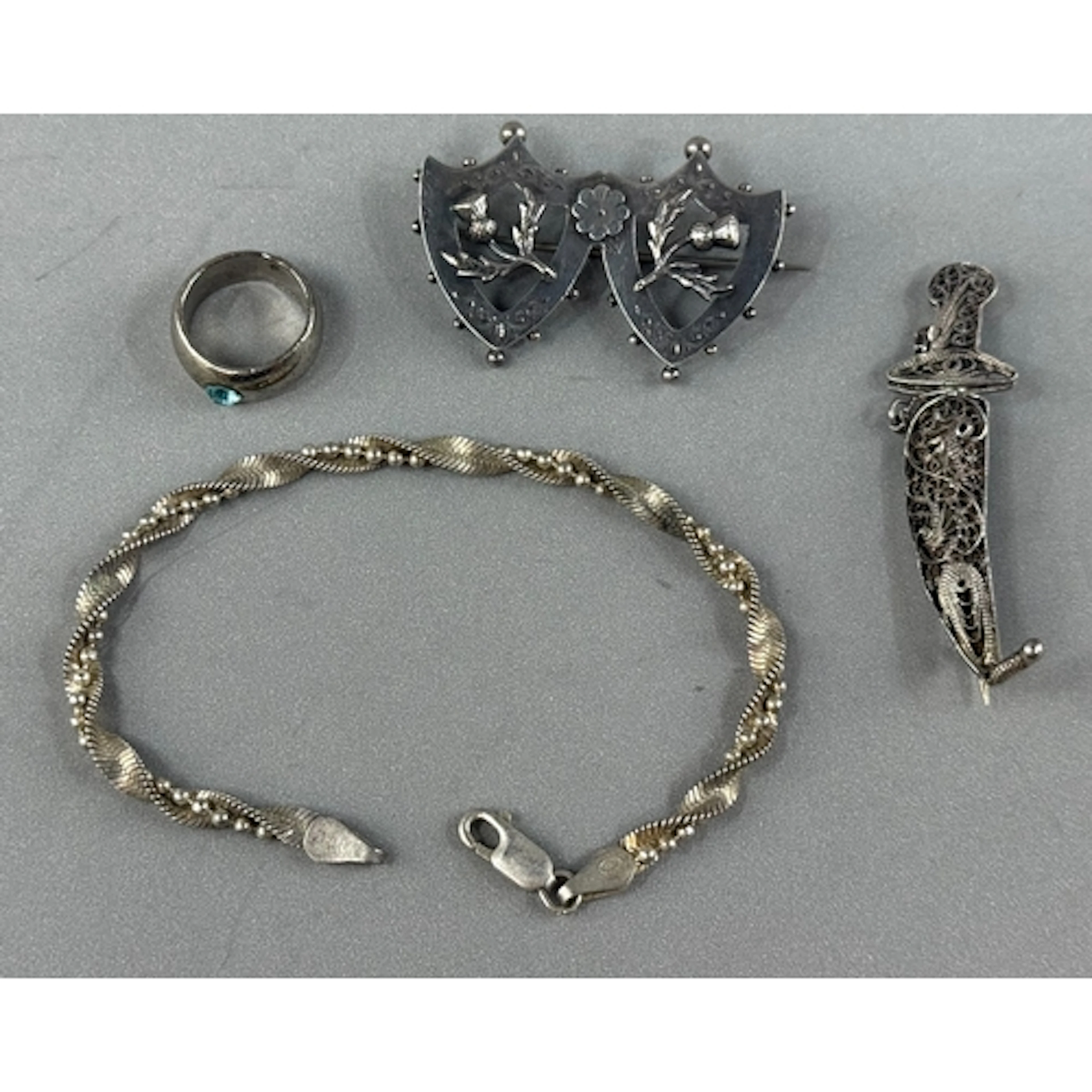 Jewellery: White metal 6mm band, a twisted link bracelet, a ...