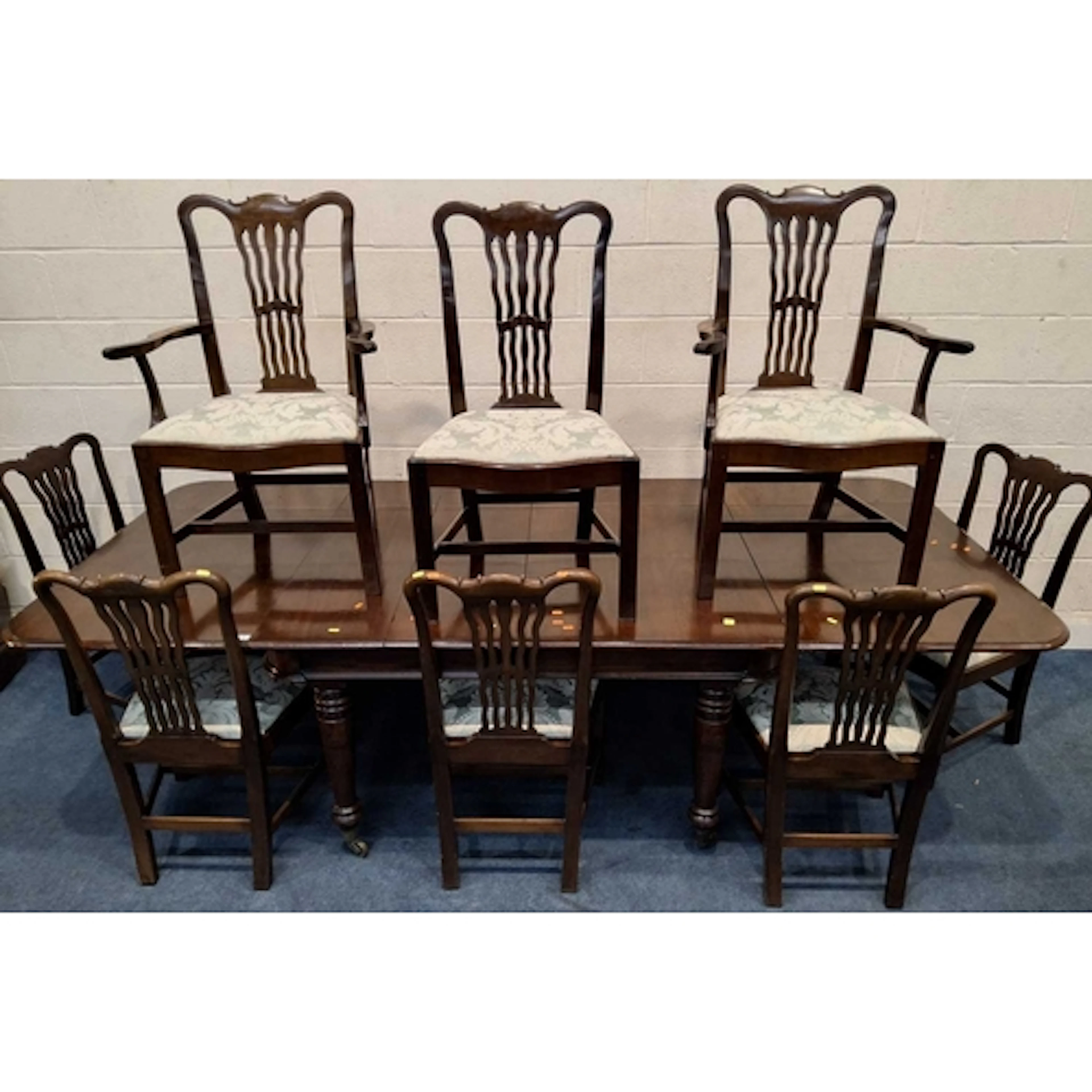 A MAHOGANY EXTENDED DINING TABLE, with three additional leav...