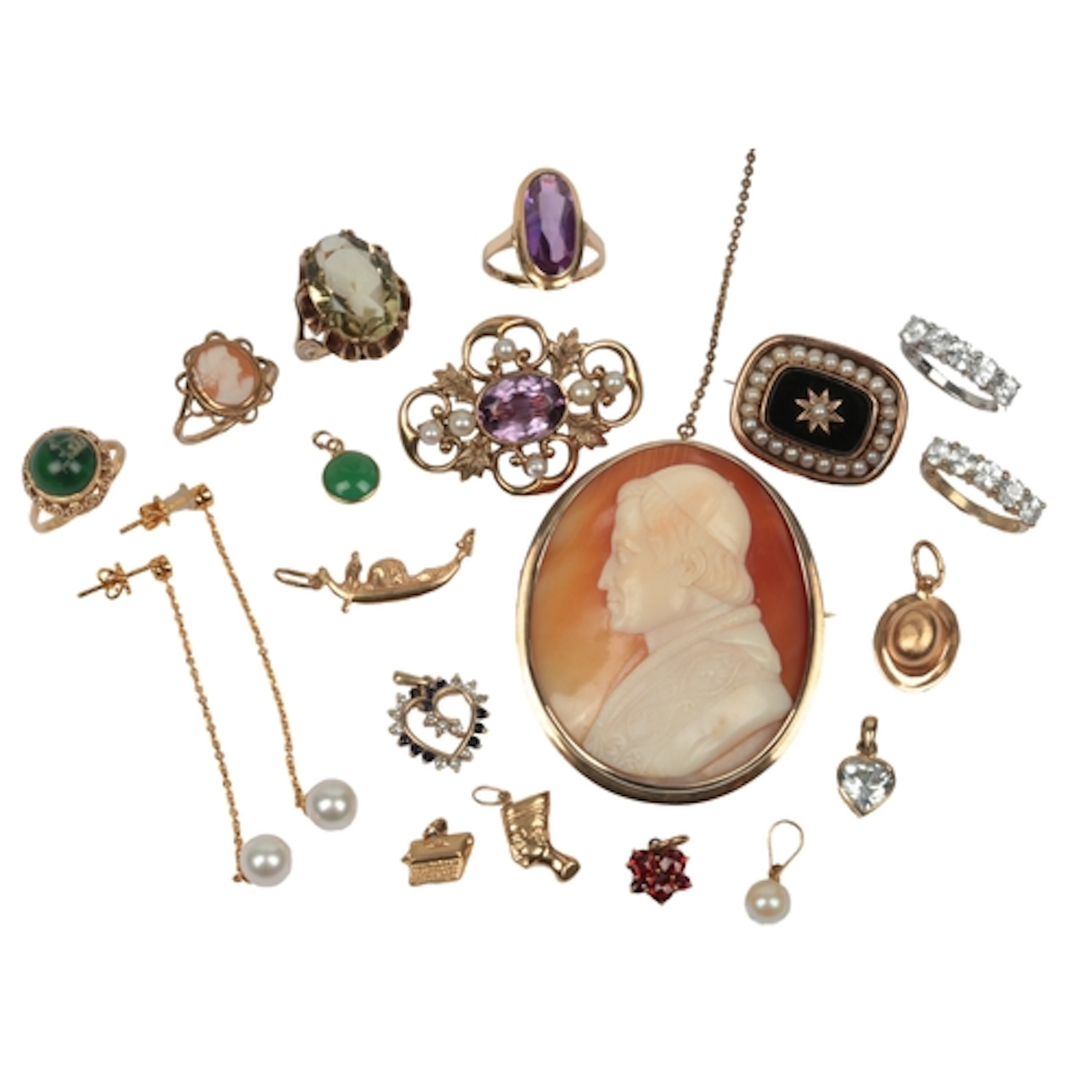 A collection of jewels including charms and shell cameo, com...