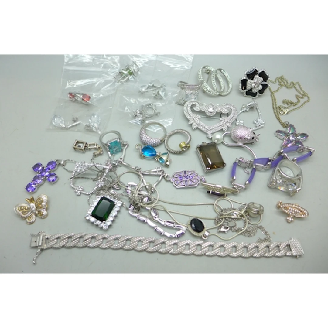 A collection of silver tone costume jewellery including some...