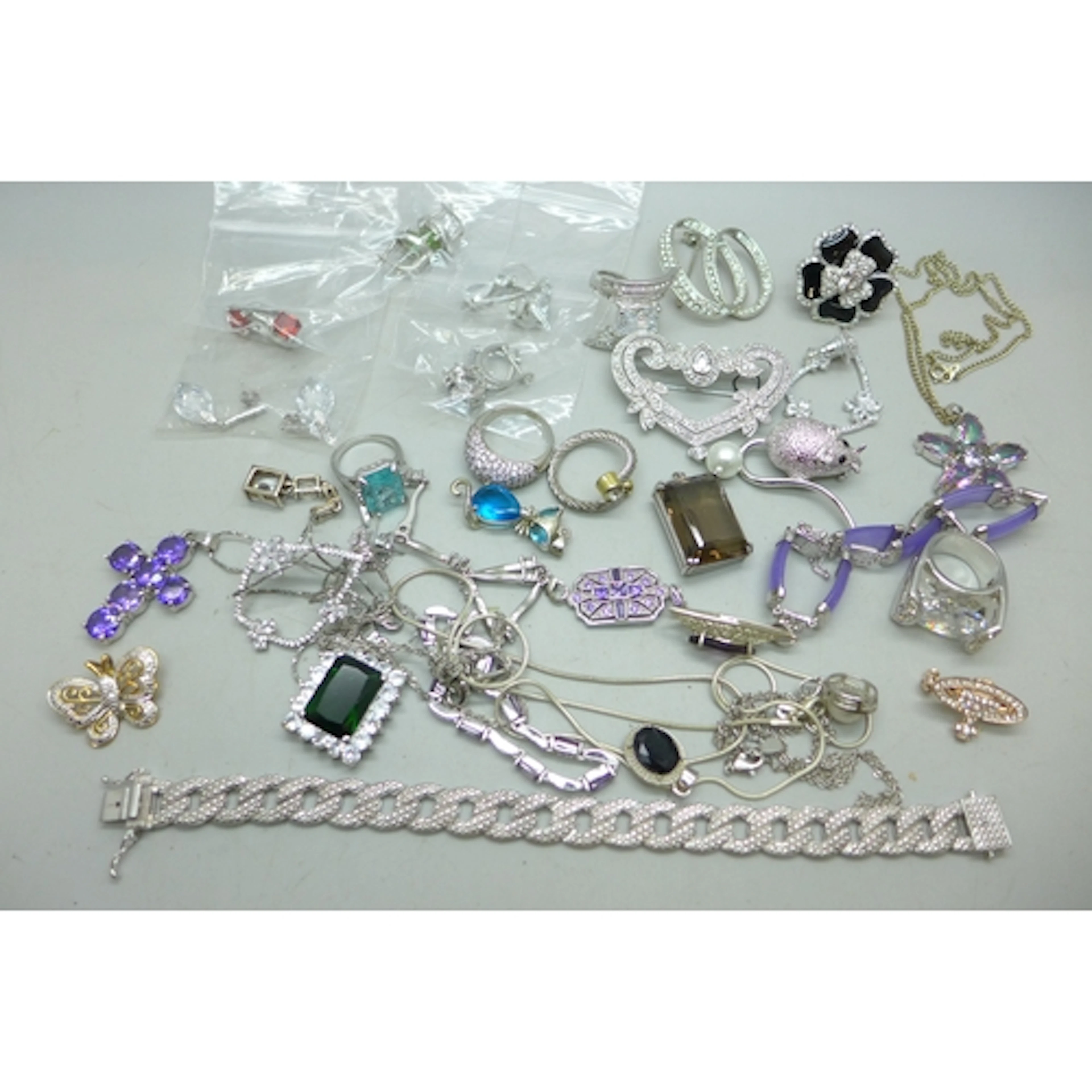 A collection of silver tone costume jewellery including some...