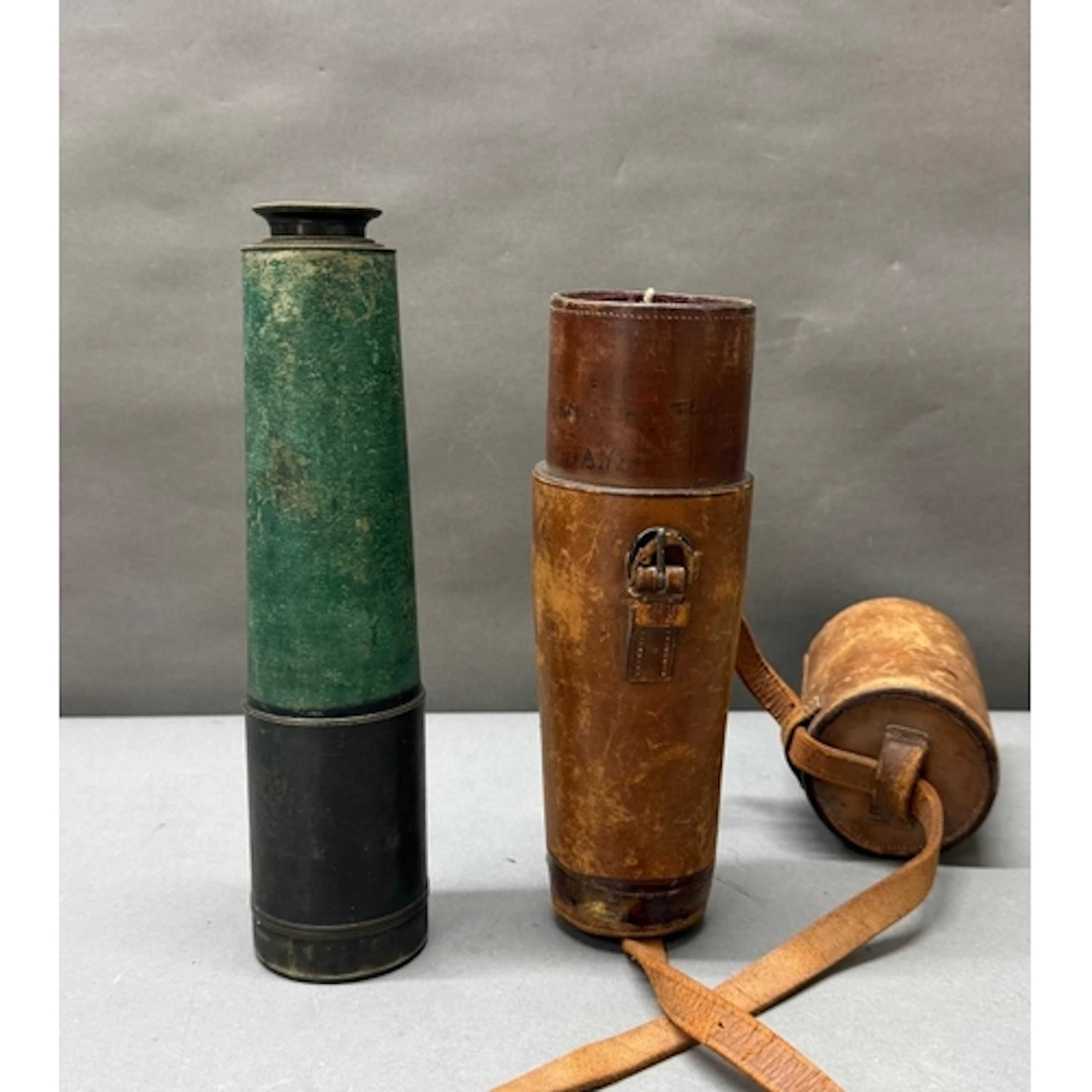 A 19th century brass and green leather single drawer telesco...