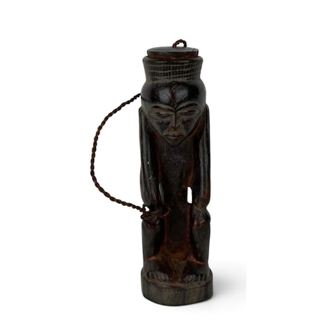 AN AFRICAN TRIBAL VESSEL WITH LID In the form of a crouching...