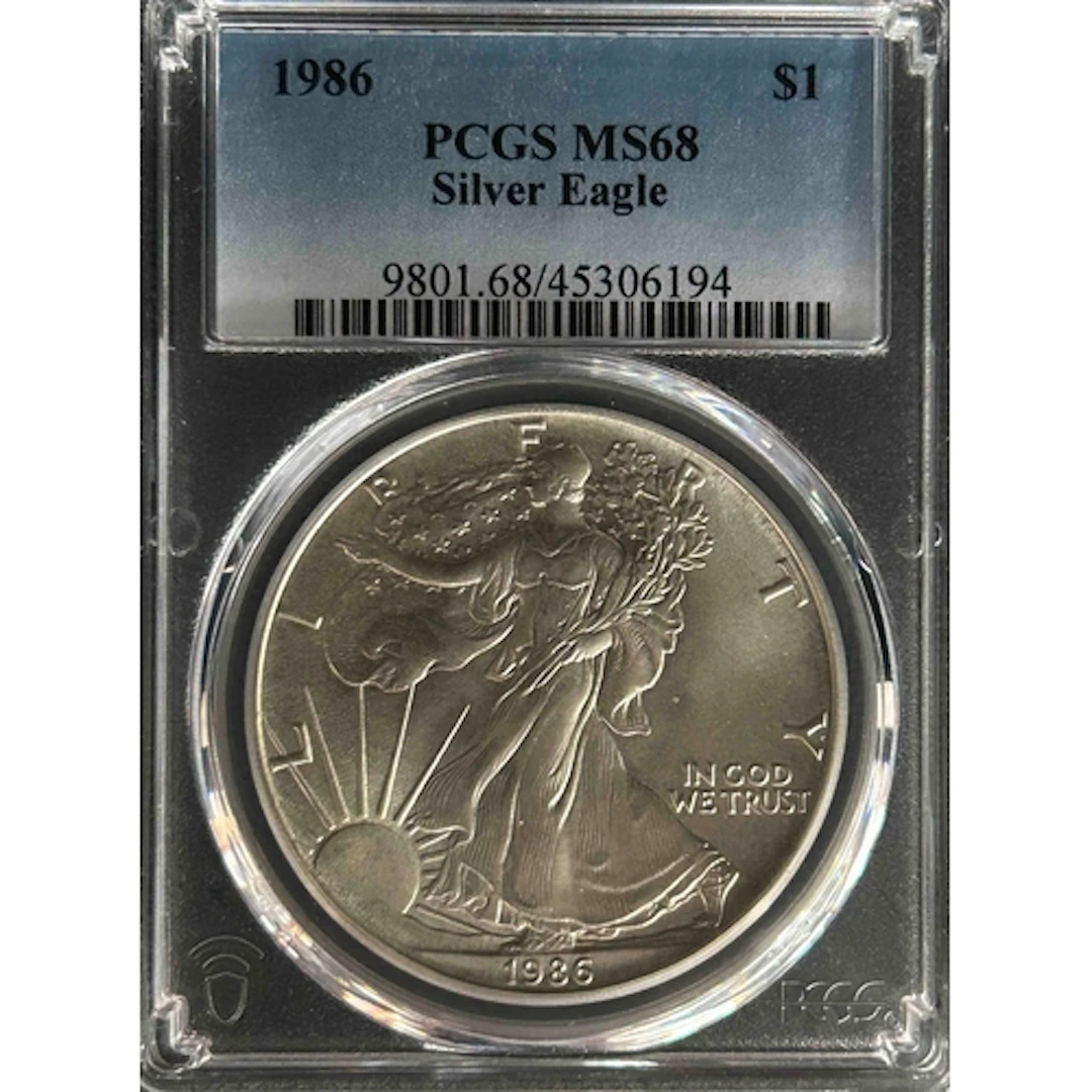 1986 USA $1 silver Eagle coin, slabbed and graded by P.C.G.S...