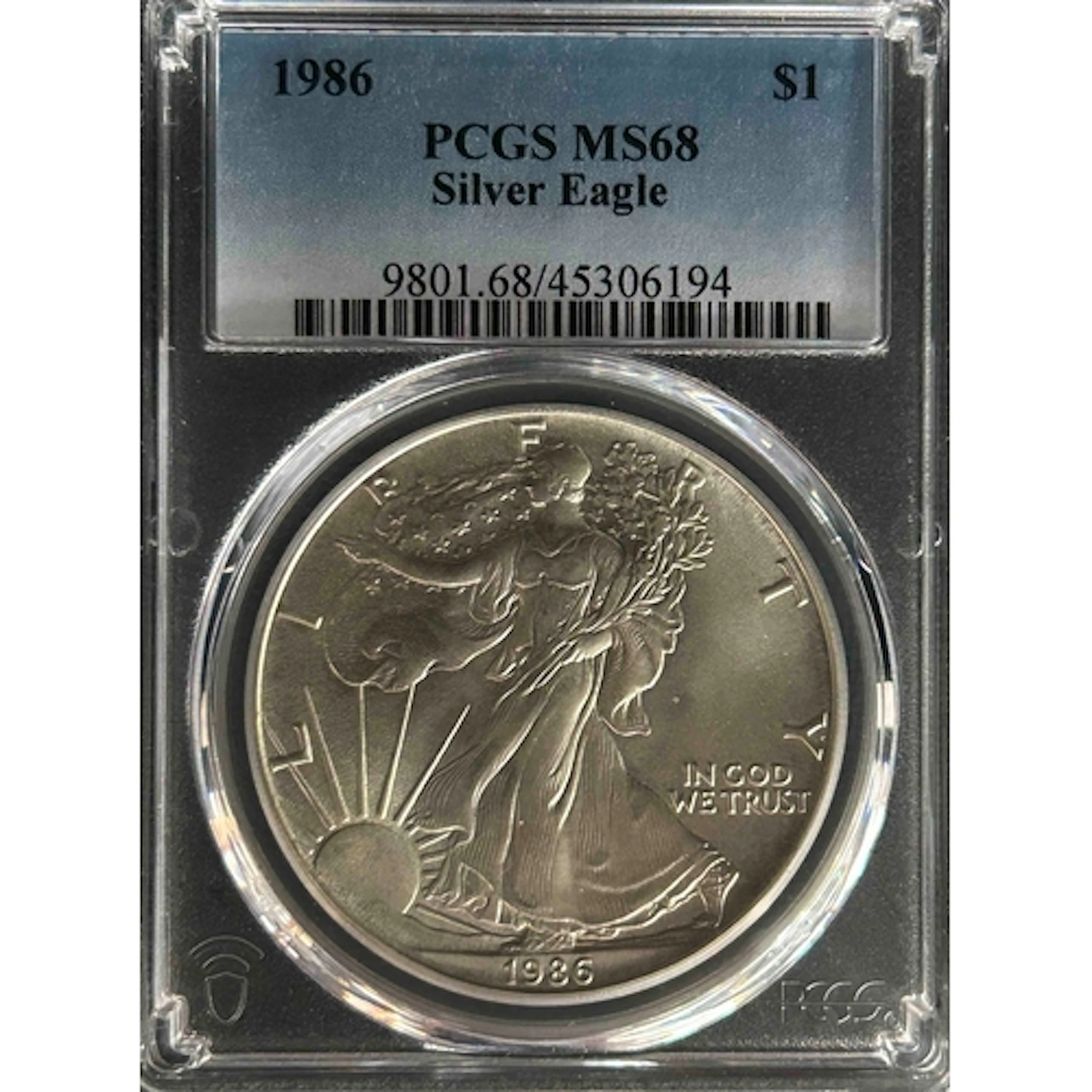 1986 USA $1 silver Eagle coin, slabbed and graded by P.C.G.S...