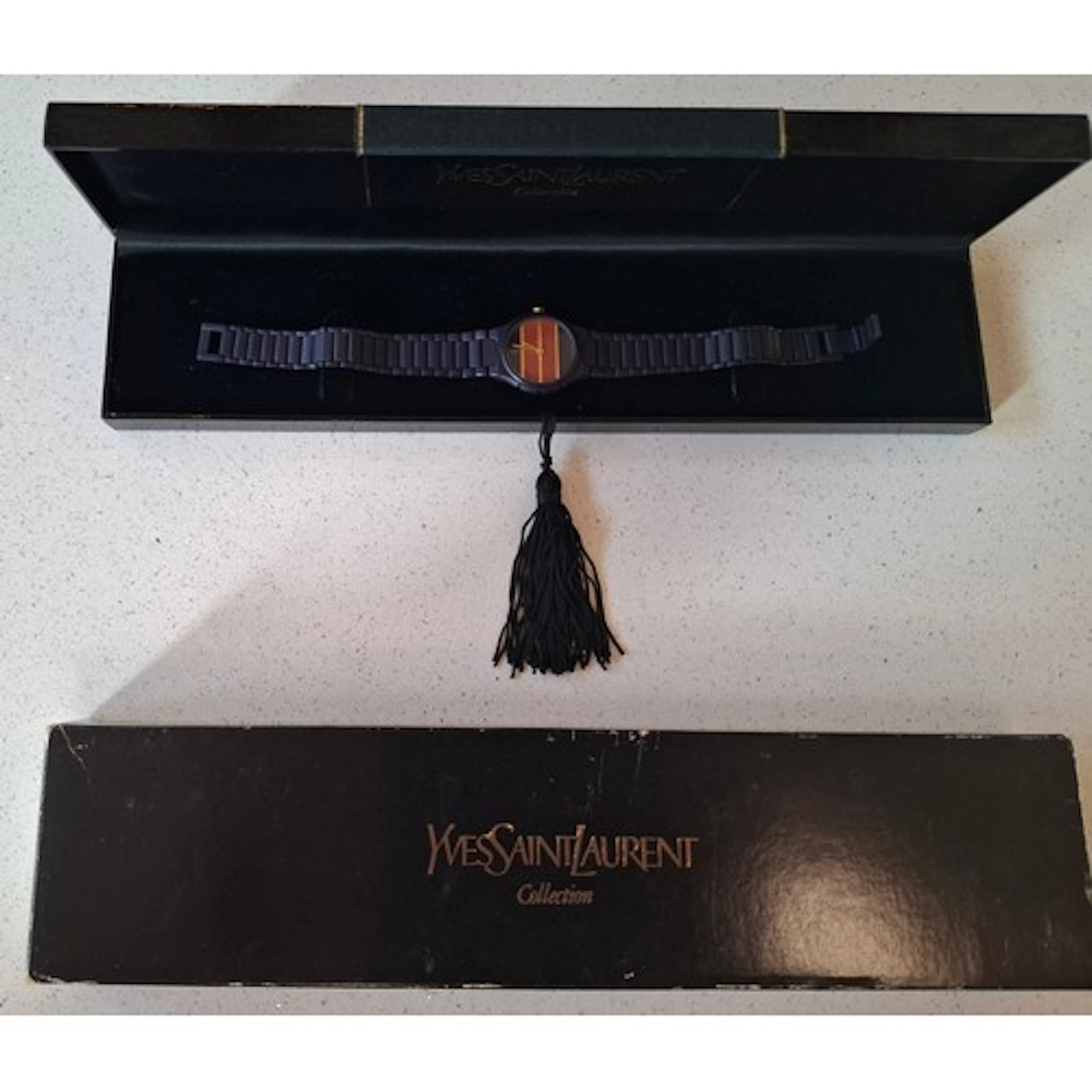 Yves Saint Laurent- A ladies YSL Coutura watch having a navy...