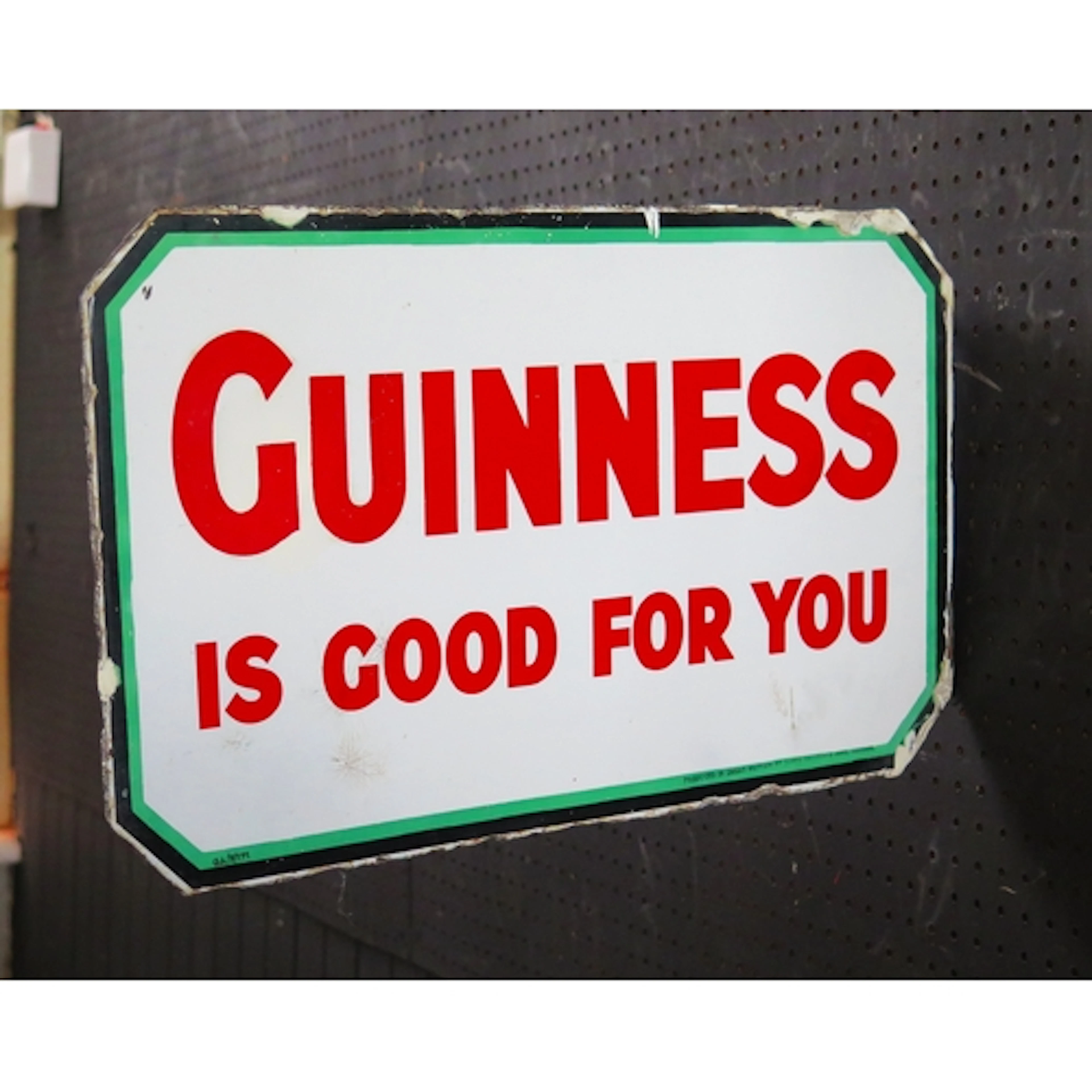 "Guinness Sold Here" - an enamel double sided advertising si...