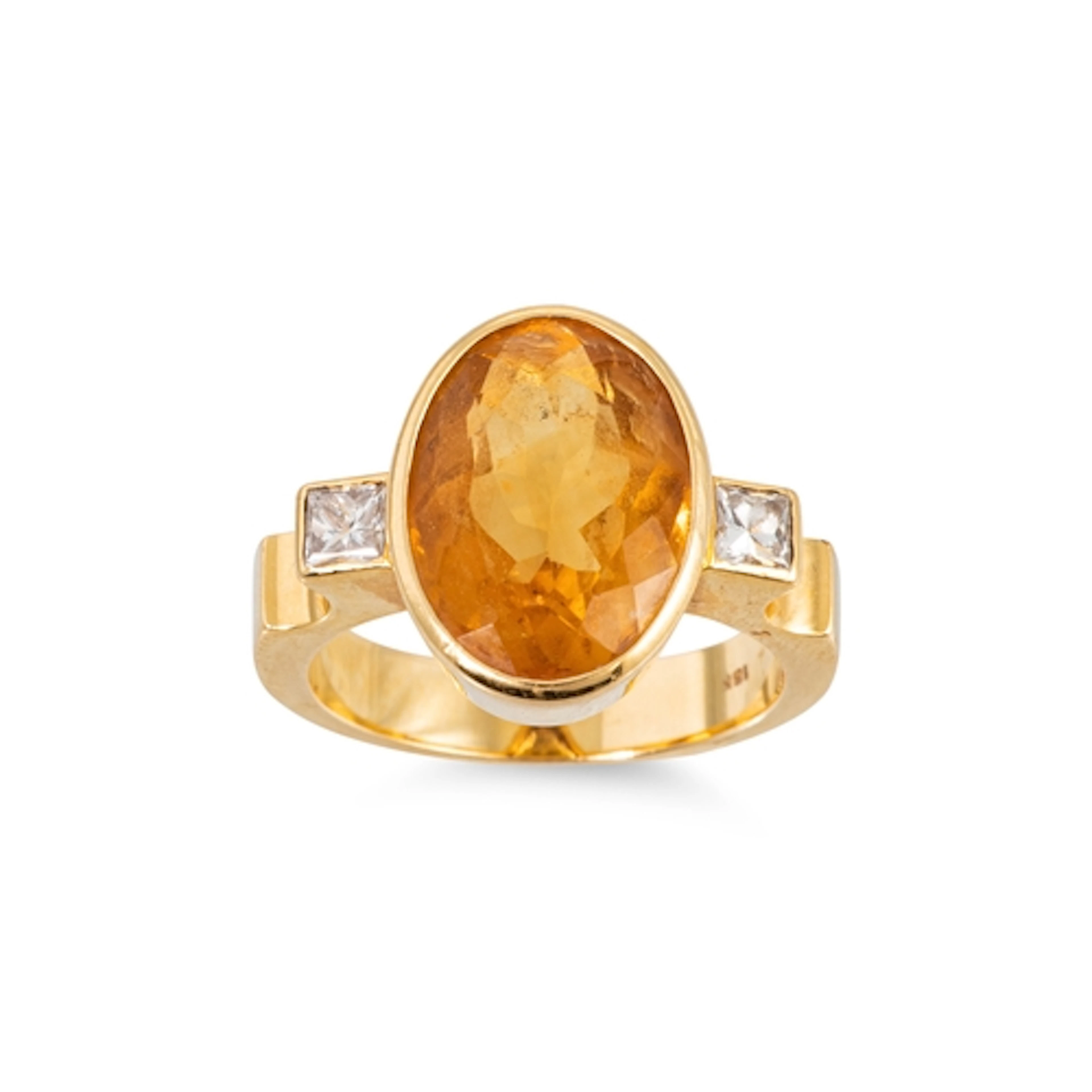 A CITRINE AND DIAMOND SET RING, the bezel set oval citrine f...