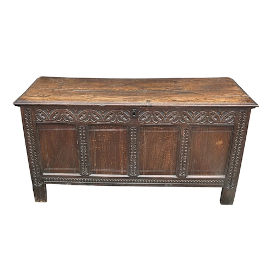 A CARVED OAK COFFER 144cm x 58cm x 74cm