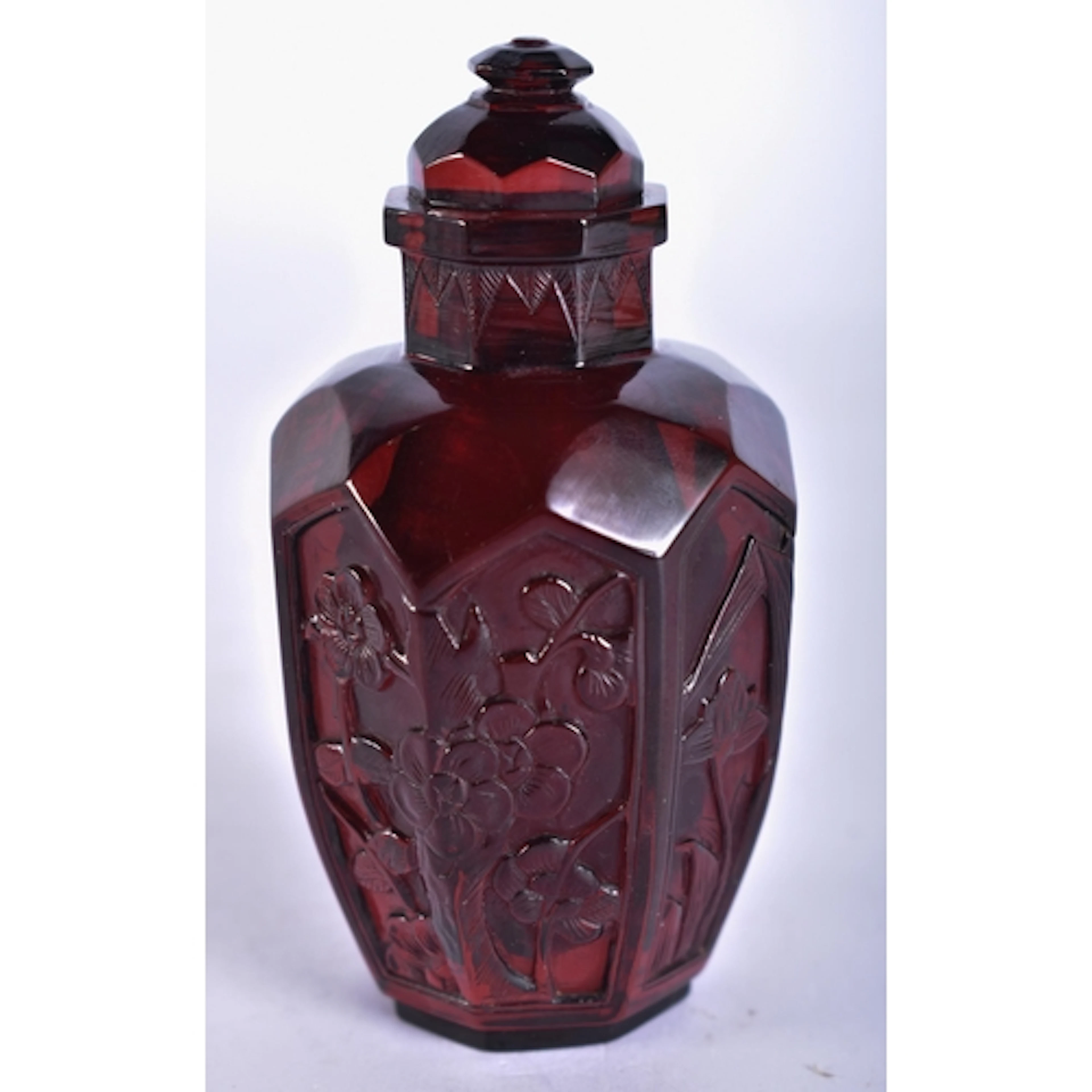 A CHINESE QING DYNASTY CARVED CHERRY FATURAN AMBER SNUFF BOT...