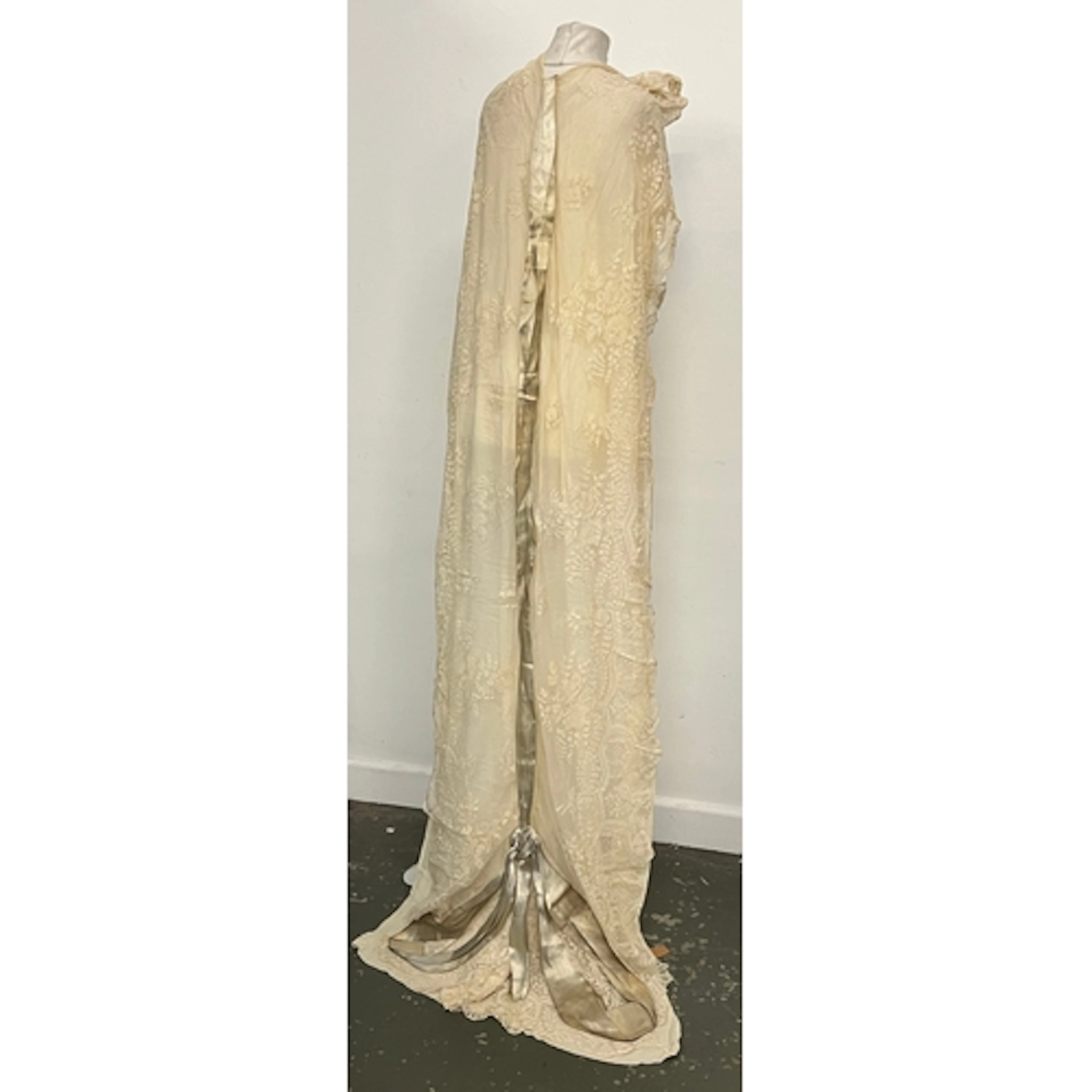 An antique lace wedding train, approx. 200cmL