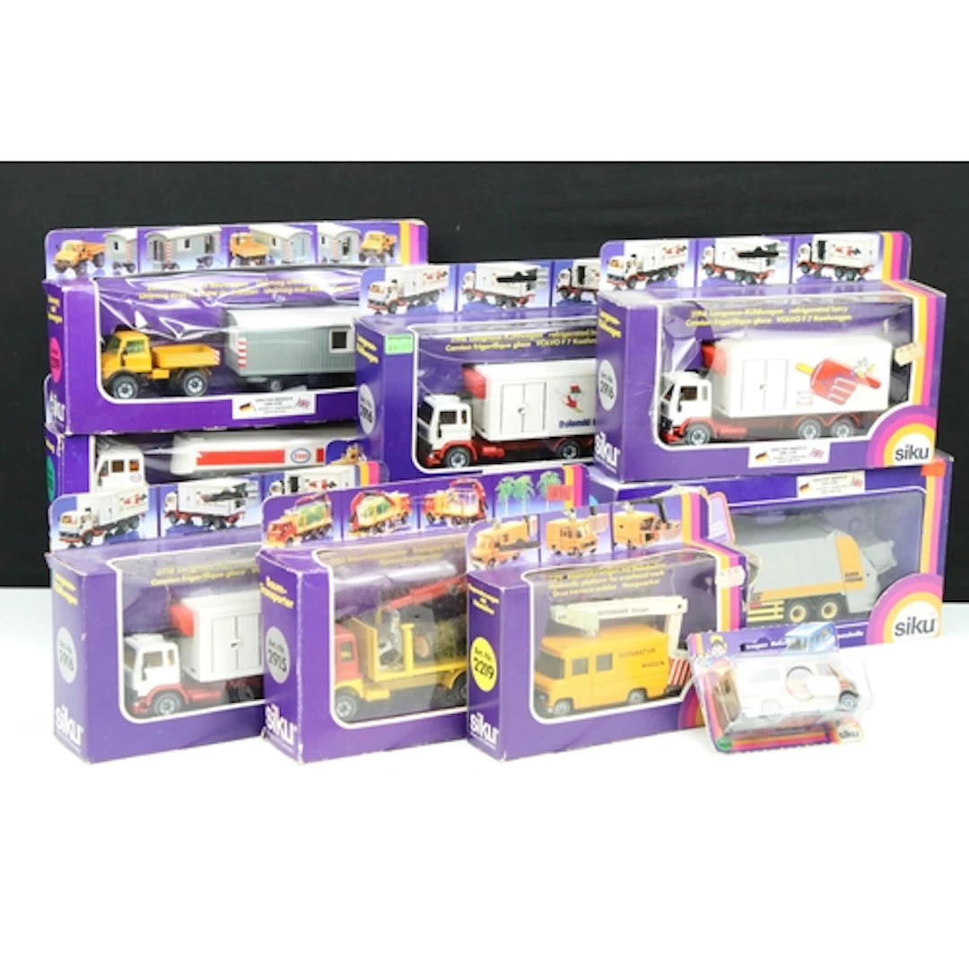11 Boxed Siku commercial related diecast models to include 2...