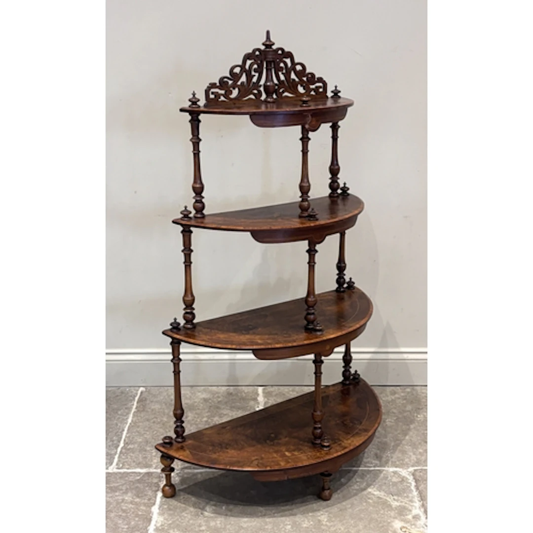 A Victorian walnut etagere, with fretwork pediment above fou...