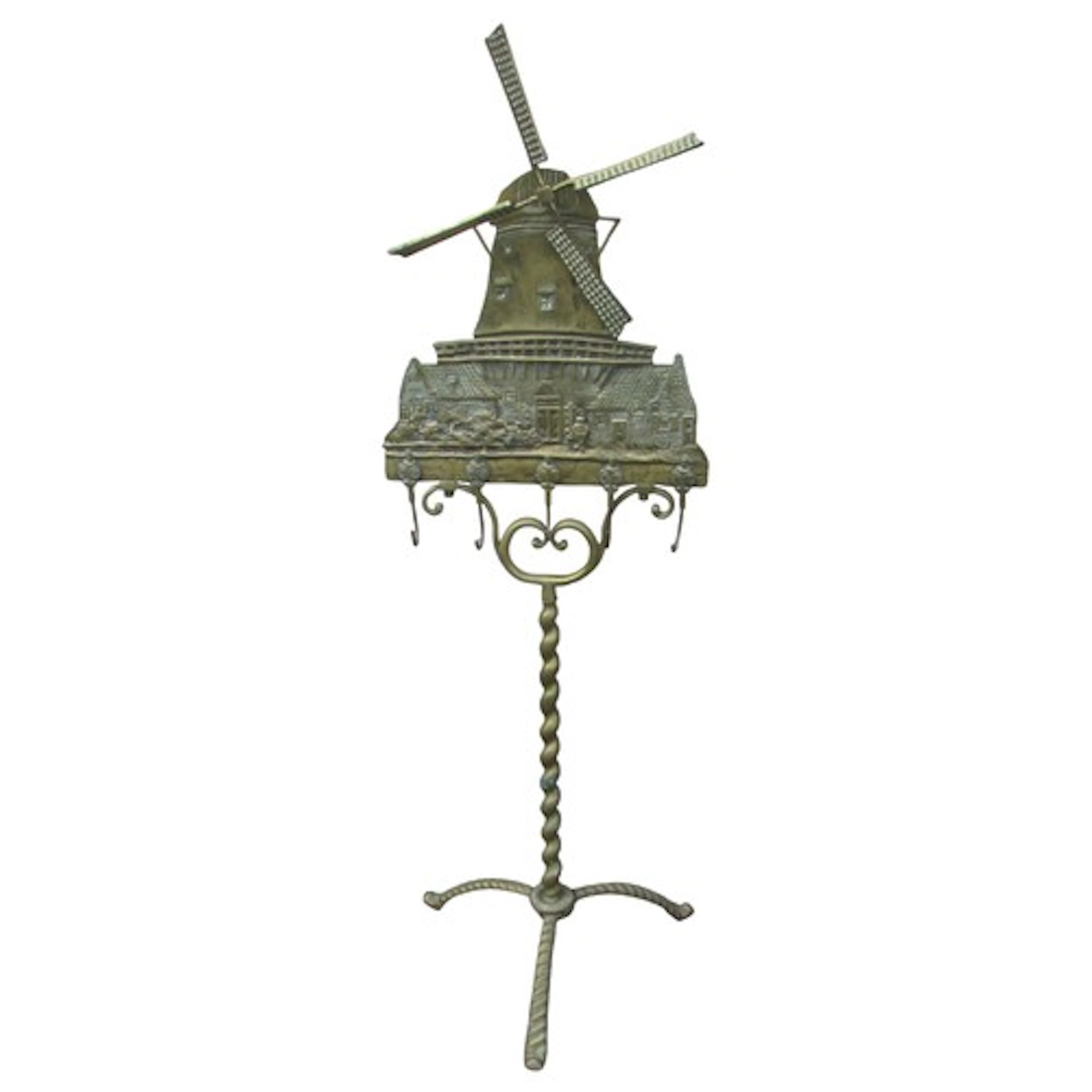 An antique brass fire side companion stand in the form of a ...