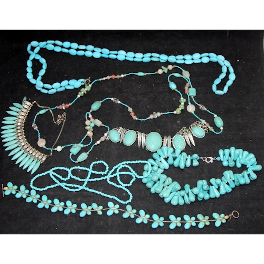 A collection of Turquoise beaded necklaces