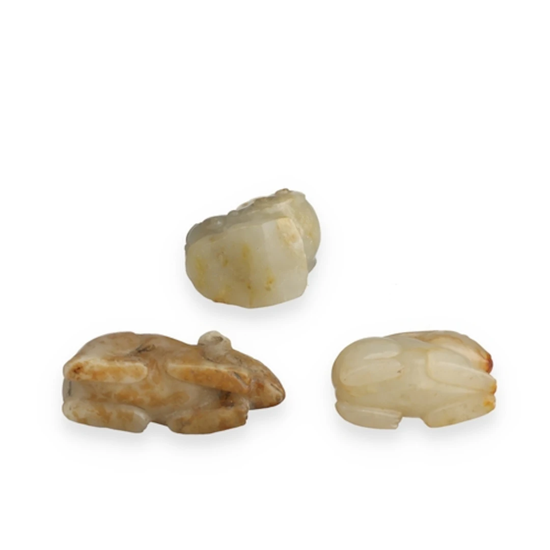 THREE CHINESE CARVED JADE ANIMALS Including a hare, mouse an...