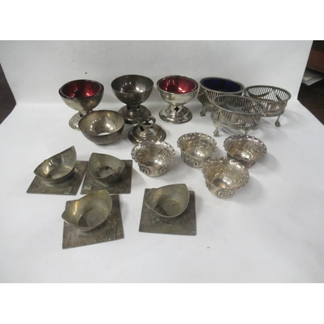 A collection of assorted silver table salts, weight 17oz, to...