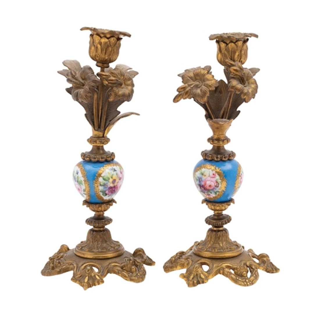 A pair of late 19th century ormulu and porcelain candlestick...