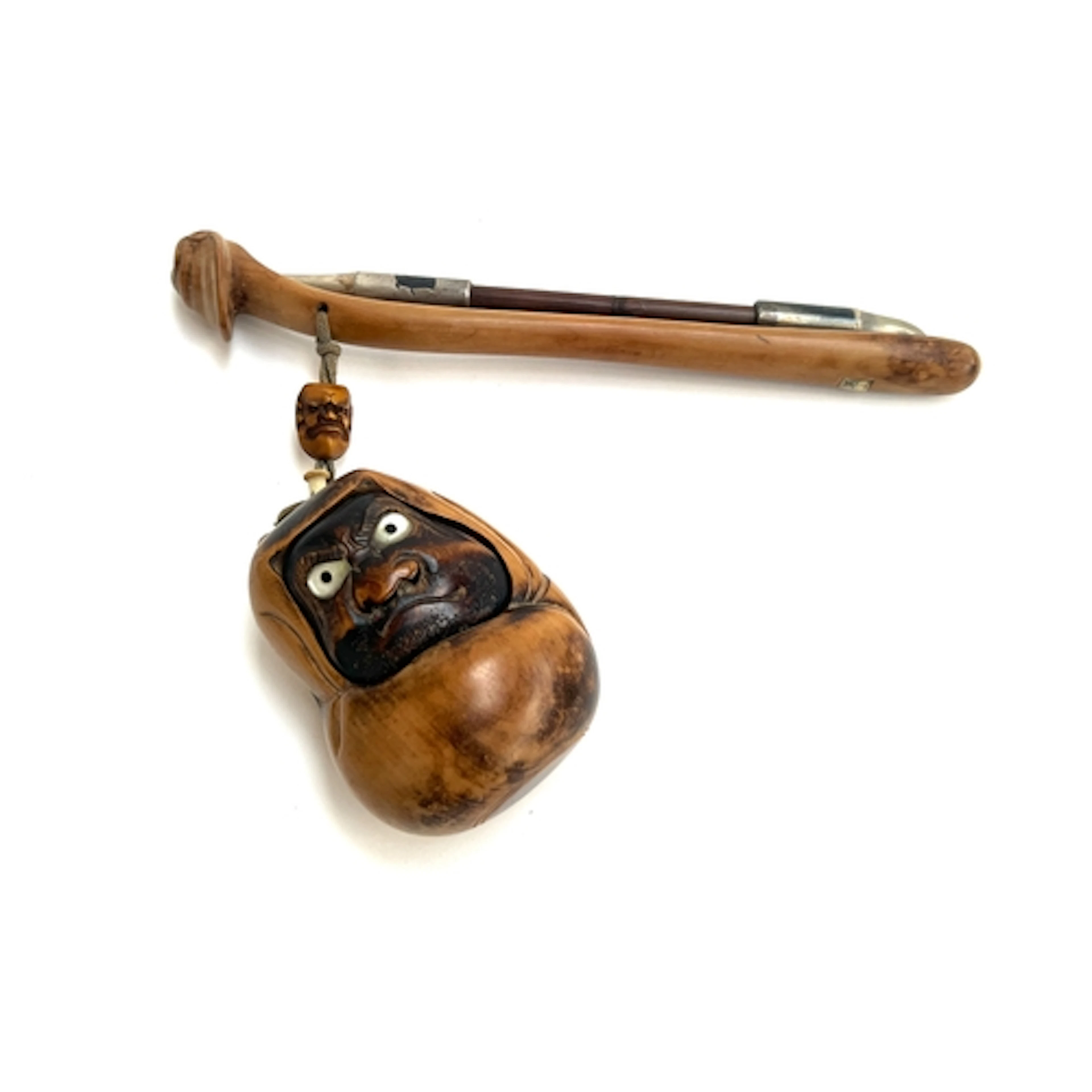 A Japanese Meiji era tonkotsu and kiseru smoking set, the wh...