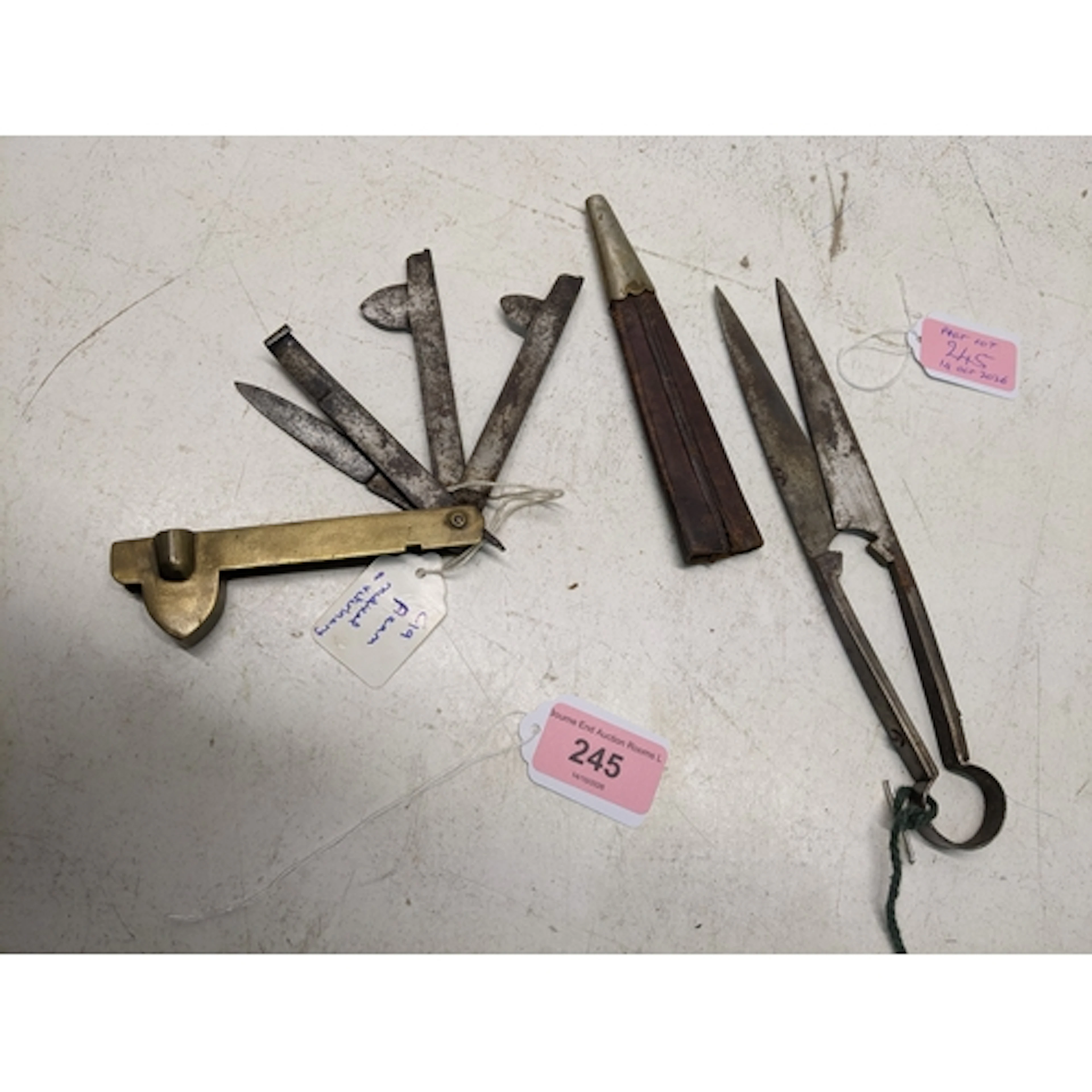 A 19th century brass and steel fleam, and an antique hand fo...